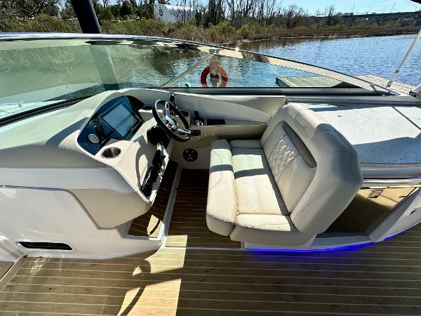 The image shows the cockpit of a 2018 Regal 3300 boat with a sleek helm station.