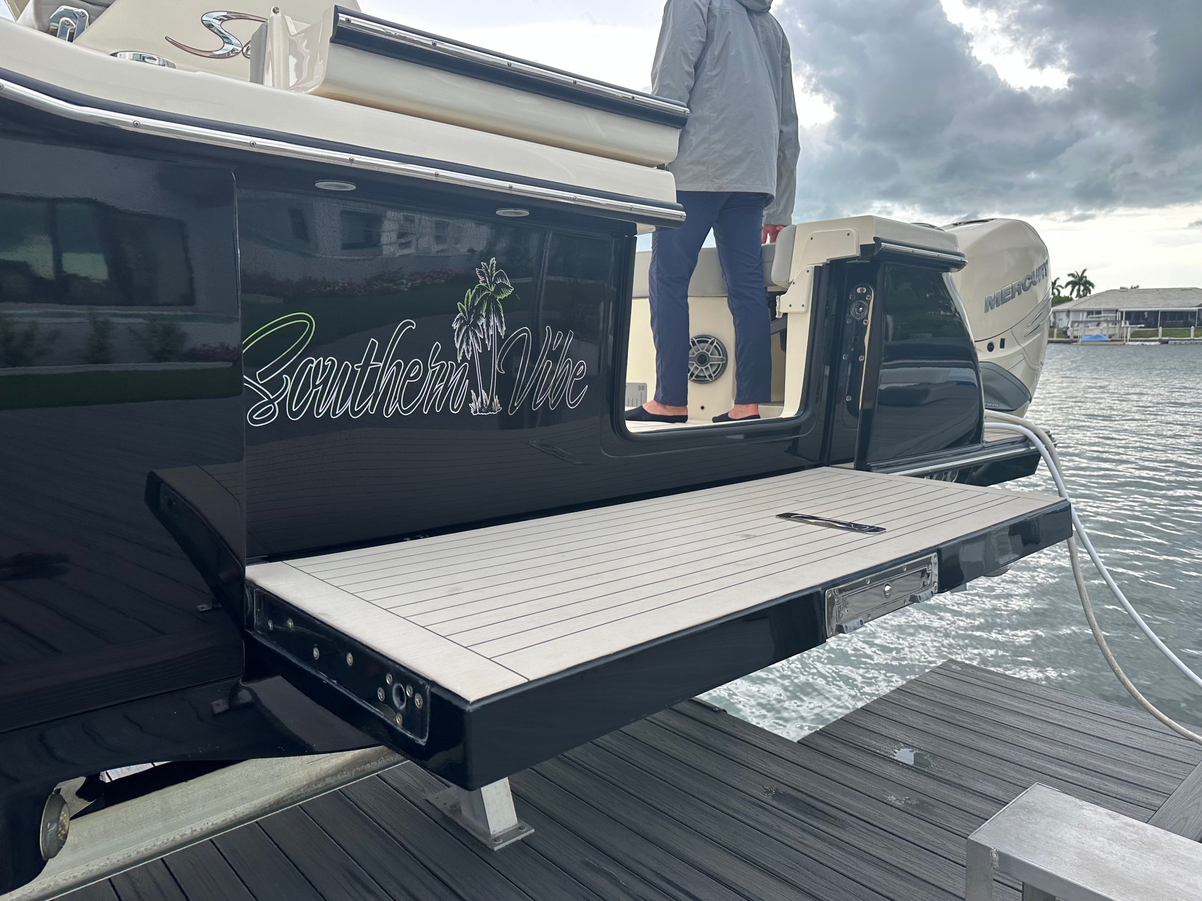 Scout 425 LXF 2022 at dock with person on board.