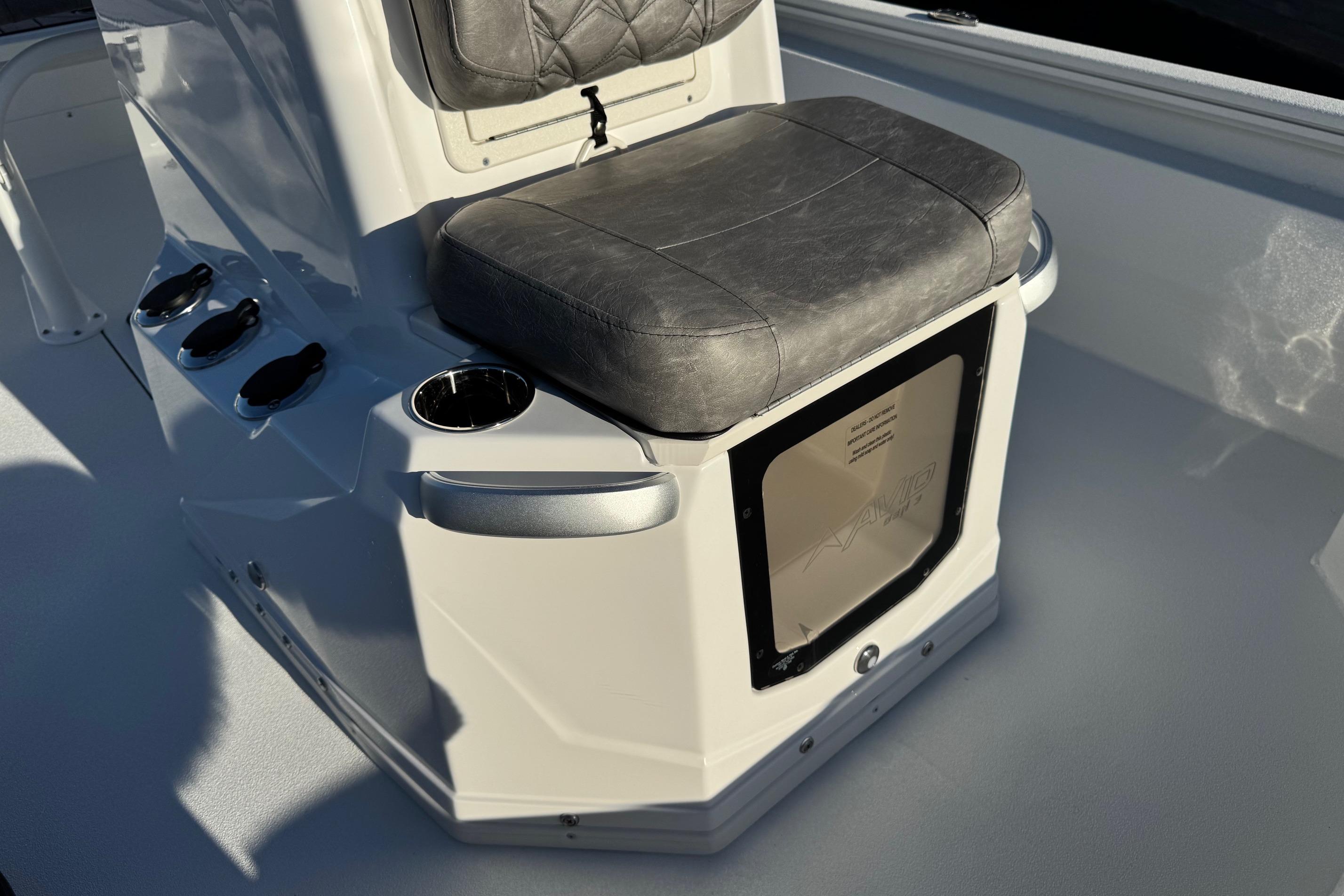 Avid 23 Mag 2025 boat seat with storage compartment and cup holder.