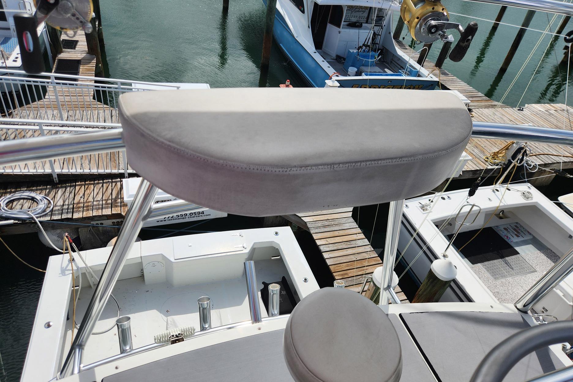 1987 Young Brothers Custom Sport Fish boat docked at marina, view from helm seat.