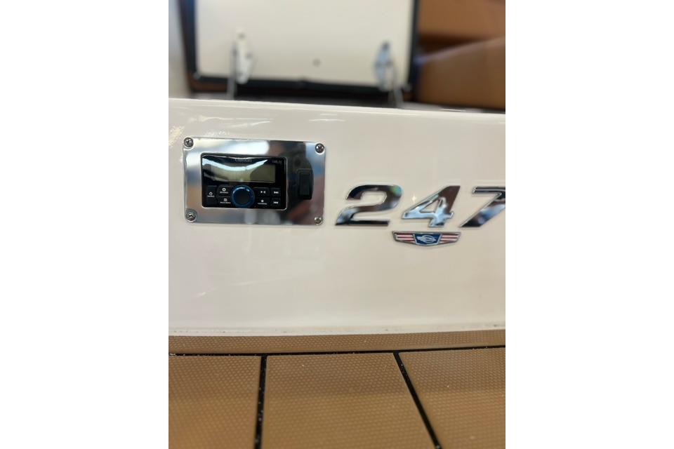 2025 Chaparral 247 SSX boat dashboard with control panel and model emblem.