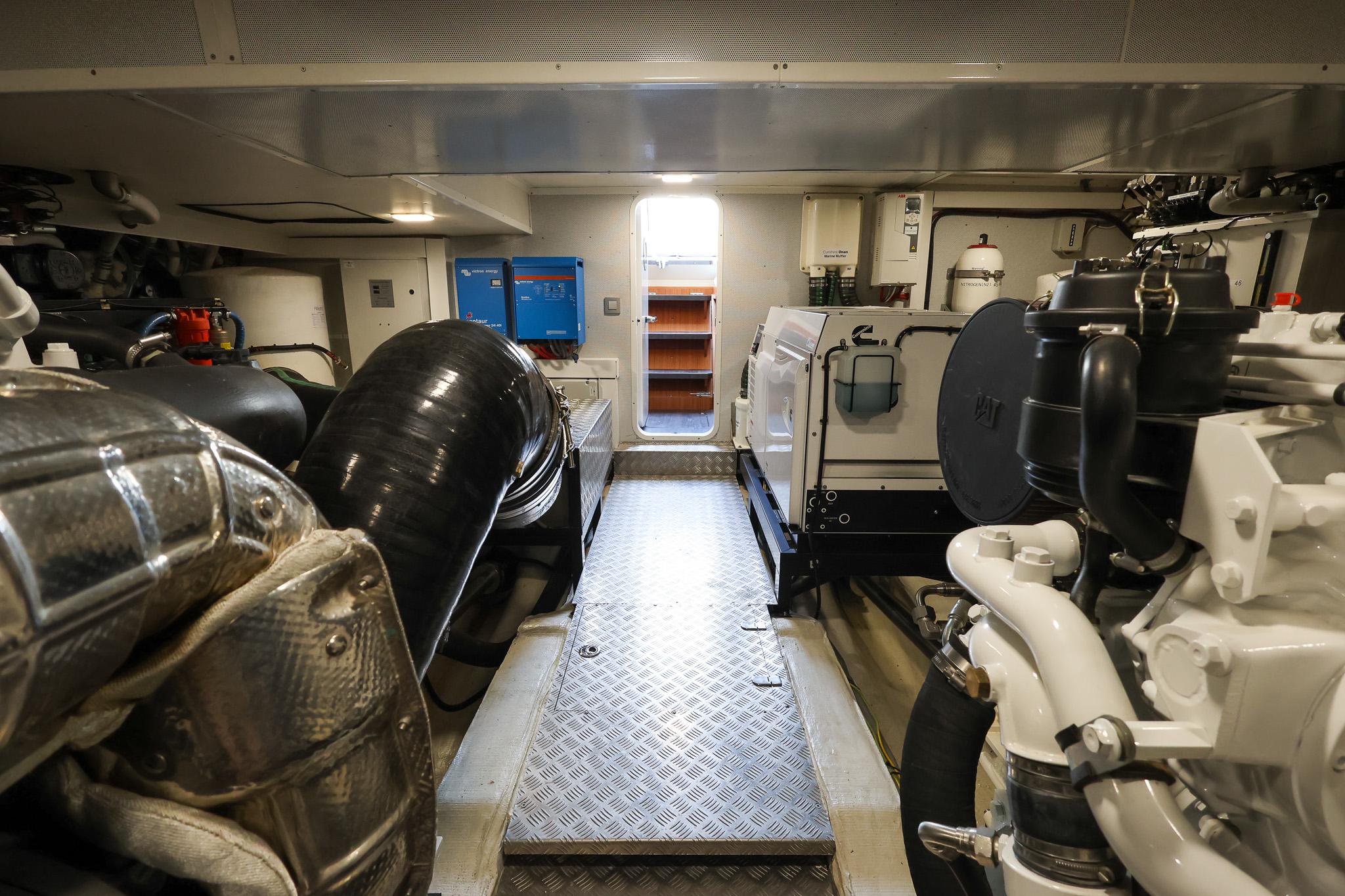 Engine room of 2021 Greenline OceanClass 68 yacht, showcasing machinery and equipment.