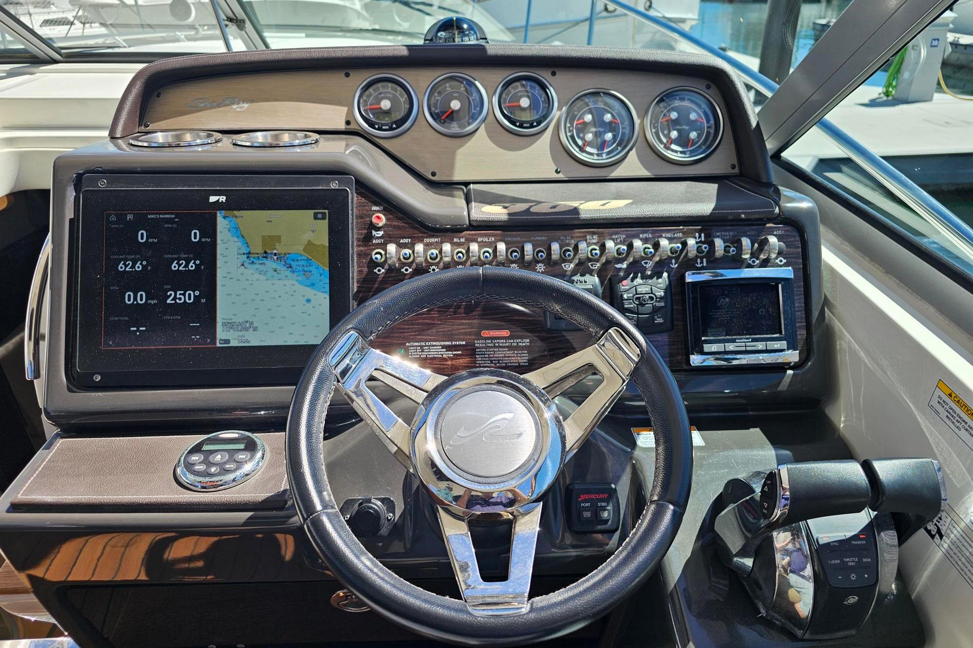 2016 Sea Ray Sundancer 350 helm with navigation display and control panel.