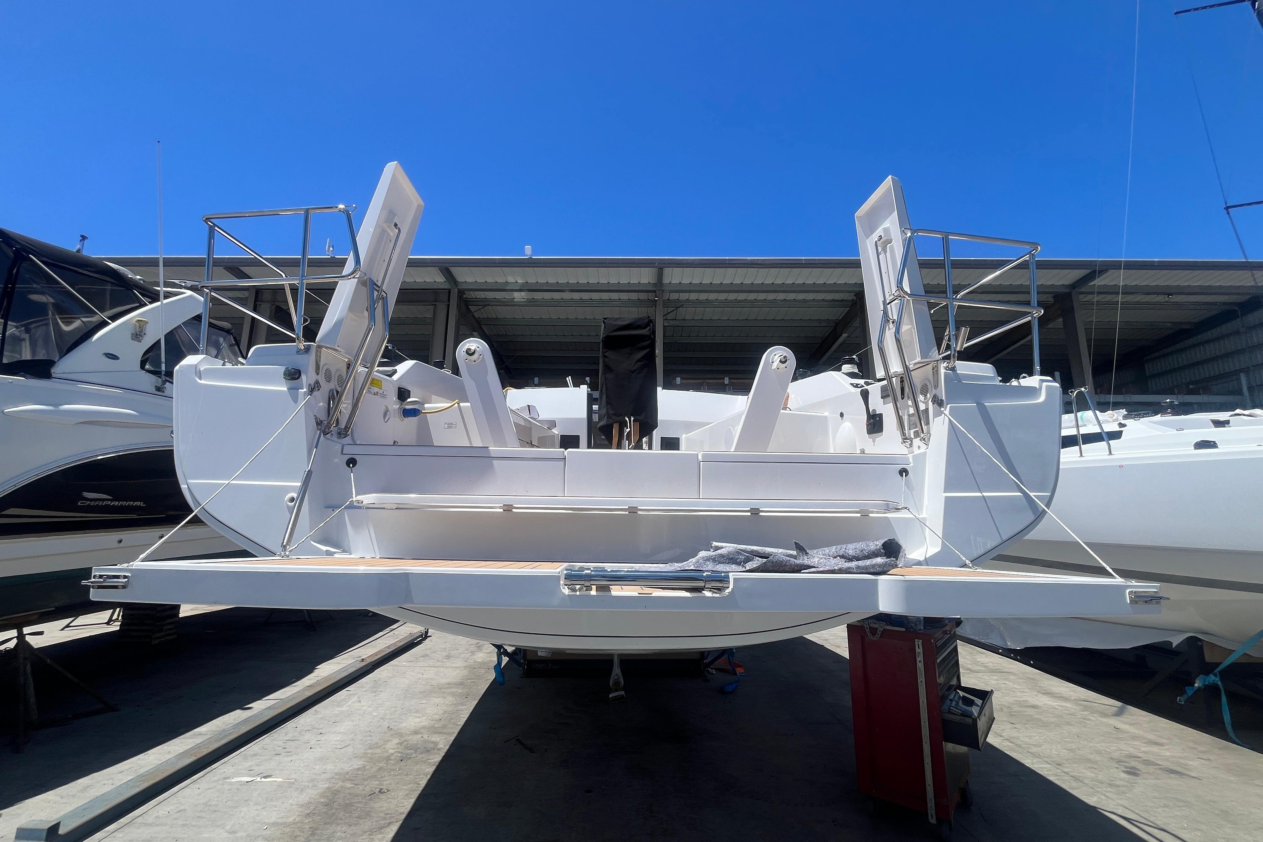 2025 Hanse 360 yacht in dry dock, showcasing open stern and sleek design.