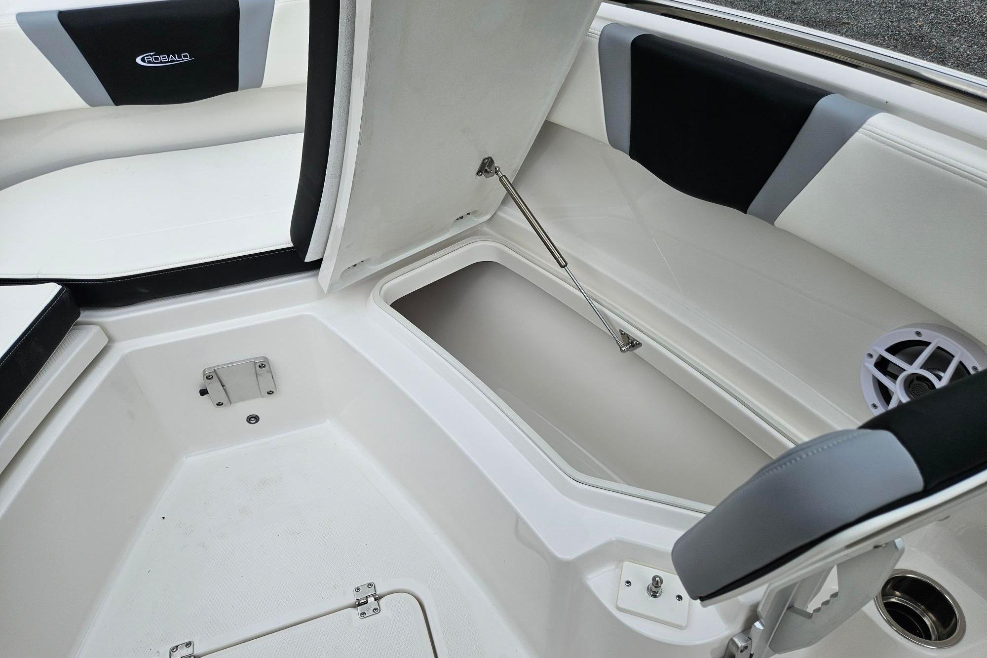 2025 Robalo R230 Center Console boat interior with open storage compartment.