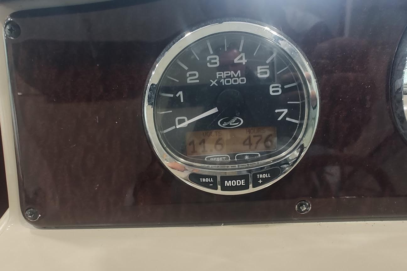 Tachometer of 2011 Sea Ray 330 Sundancer displaying RPM and engine hours.