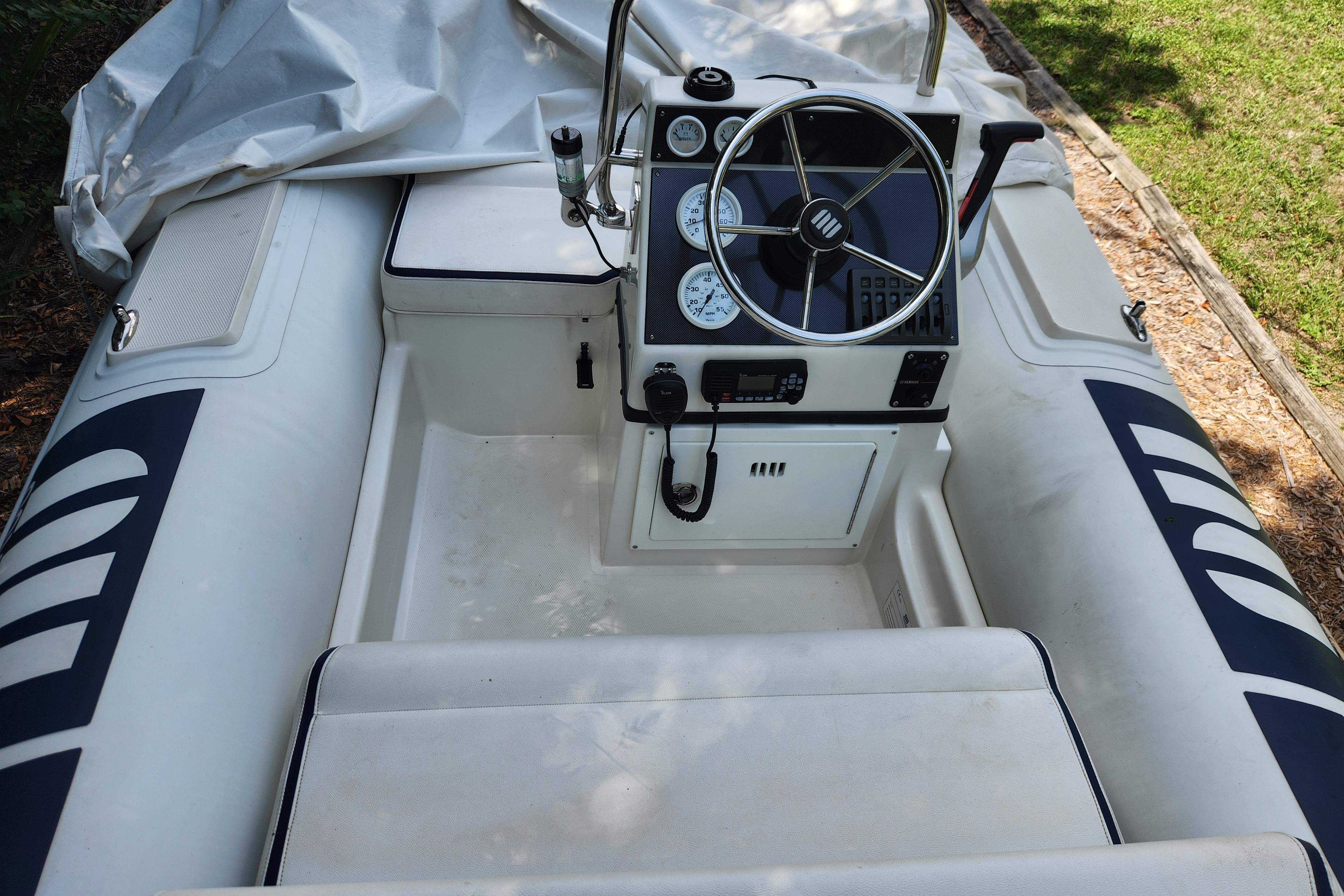 2019 Novurania DL 400 inflatable boat interior with steering wheel and control panel.