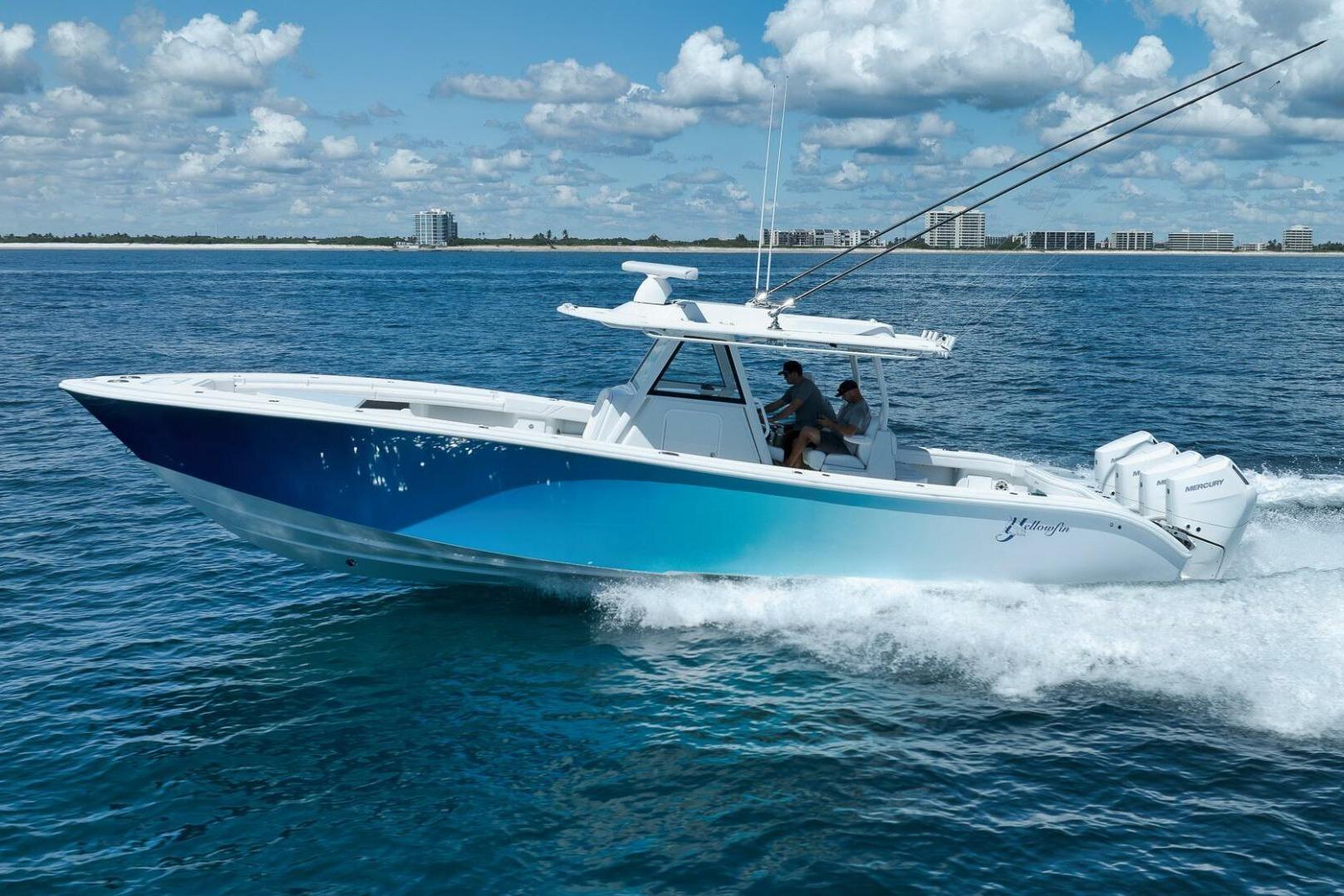 2023 Yellowfin 39 Offshore boat cruising on open water under a blue sky.