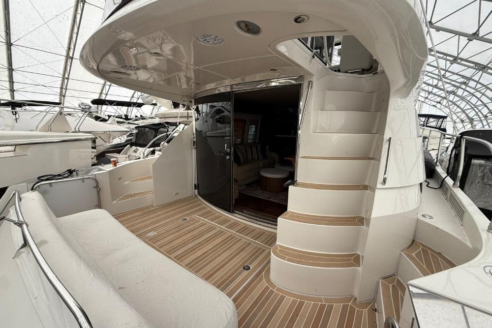Luxury 2007 Marquis 55 LS yacht interior with elegant seating and staircase.