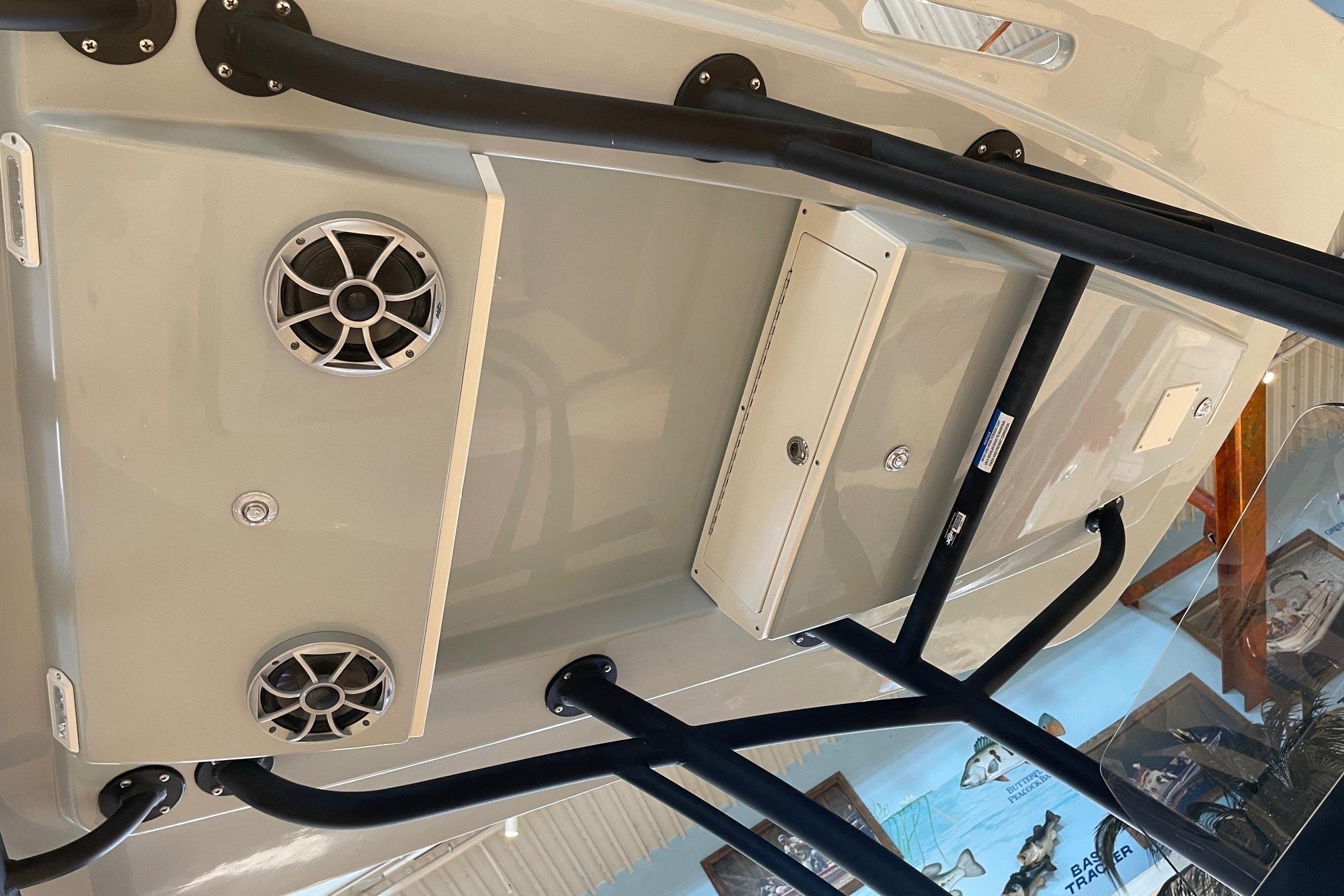 2026 Mako 24 APEX boat interior with speakers and storage compartments.