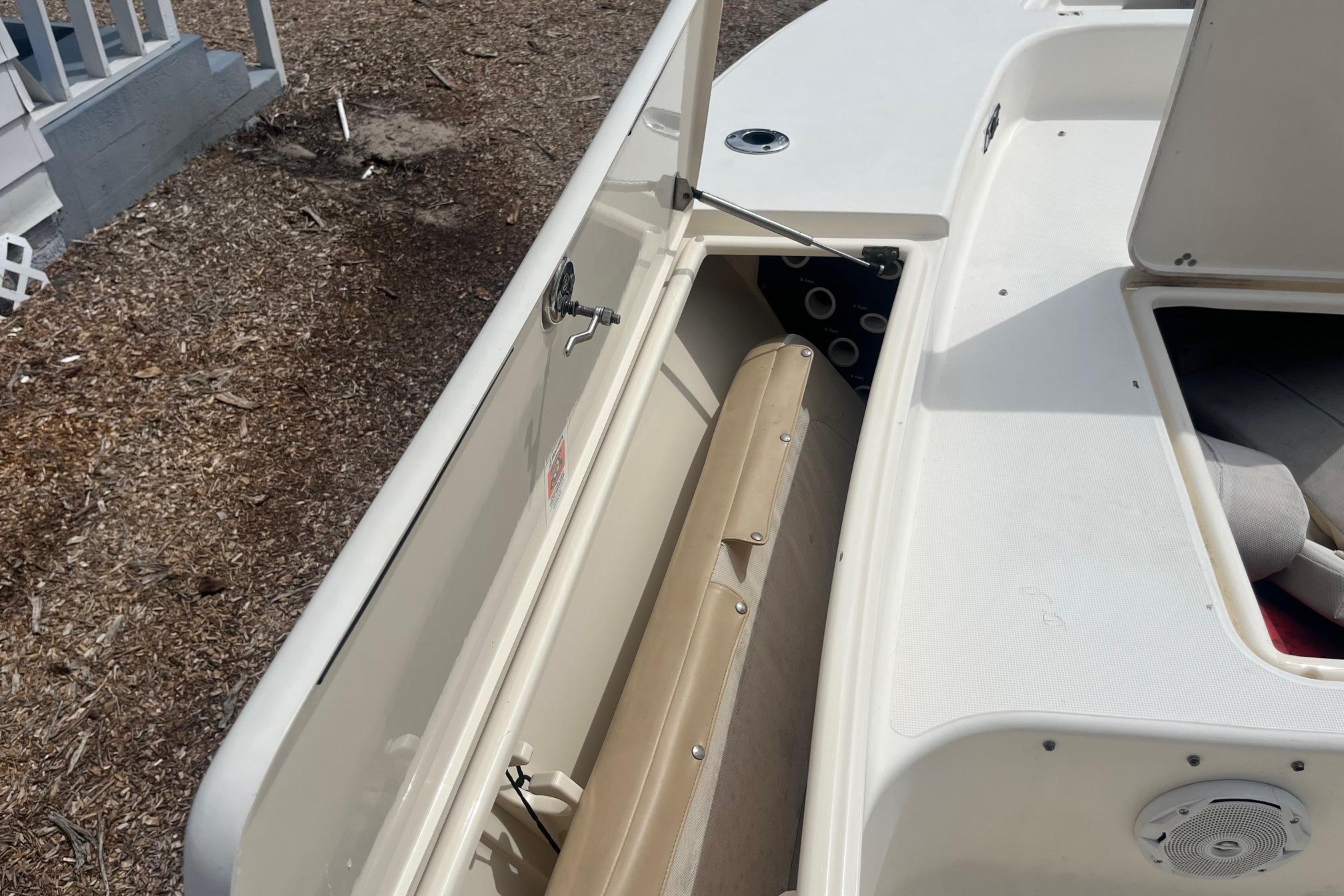 2009 Scout 221 Winyah Bay boat interior with open storage compartment.