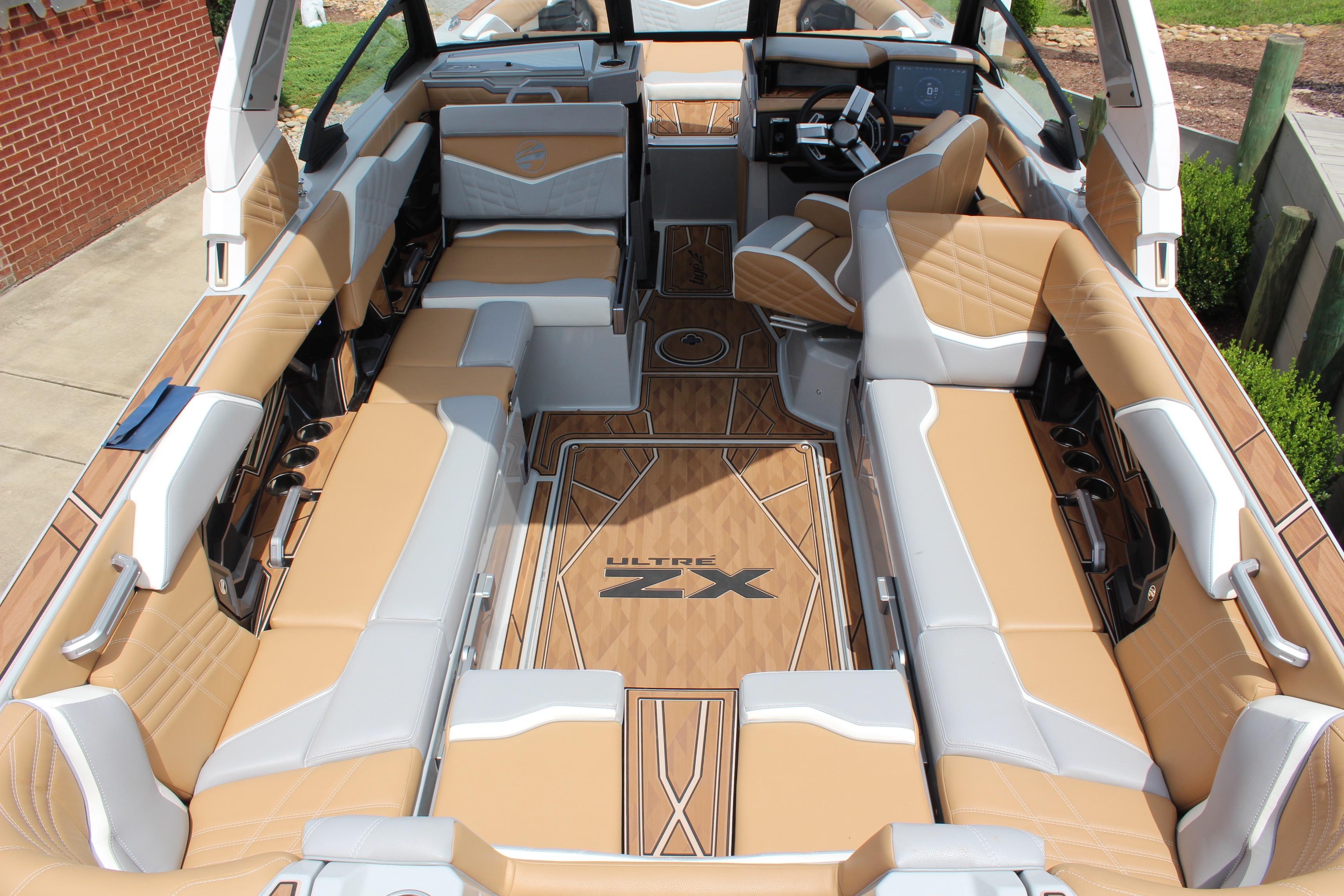 2024 Tigé Ultré 25ZX boat interior with luxurious tan and gray seating.