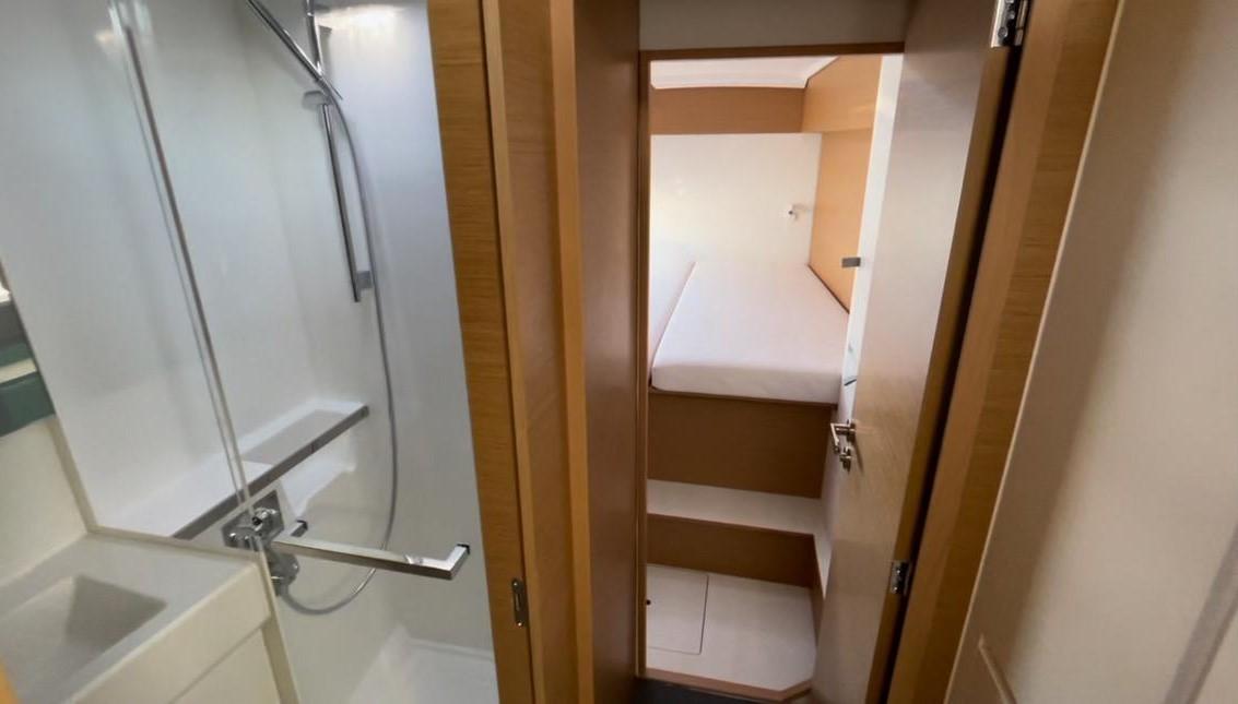 Interior of 2021 Excess 11 yacht showing bathroom and cozy cabin.