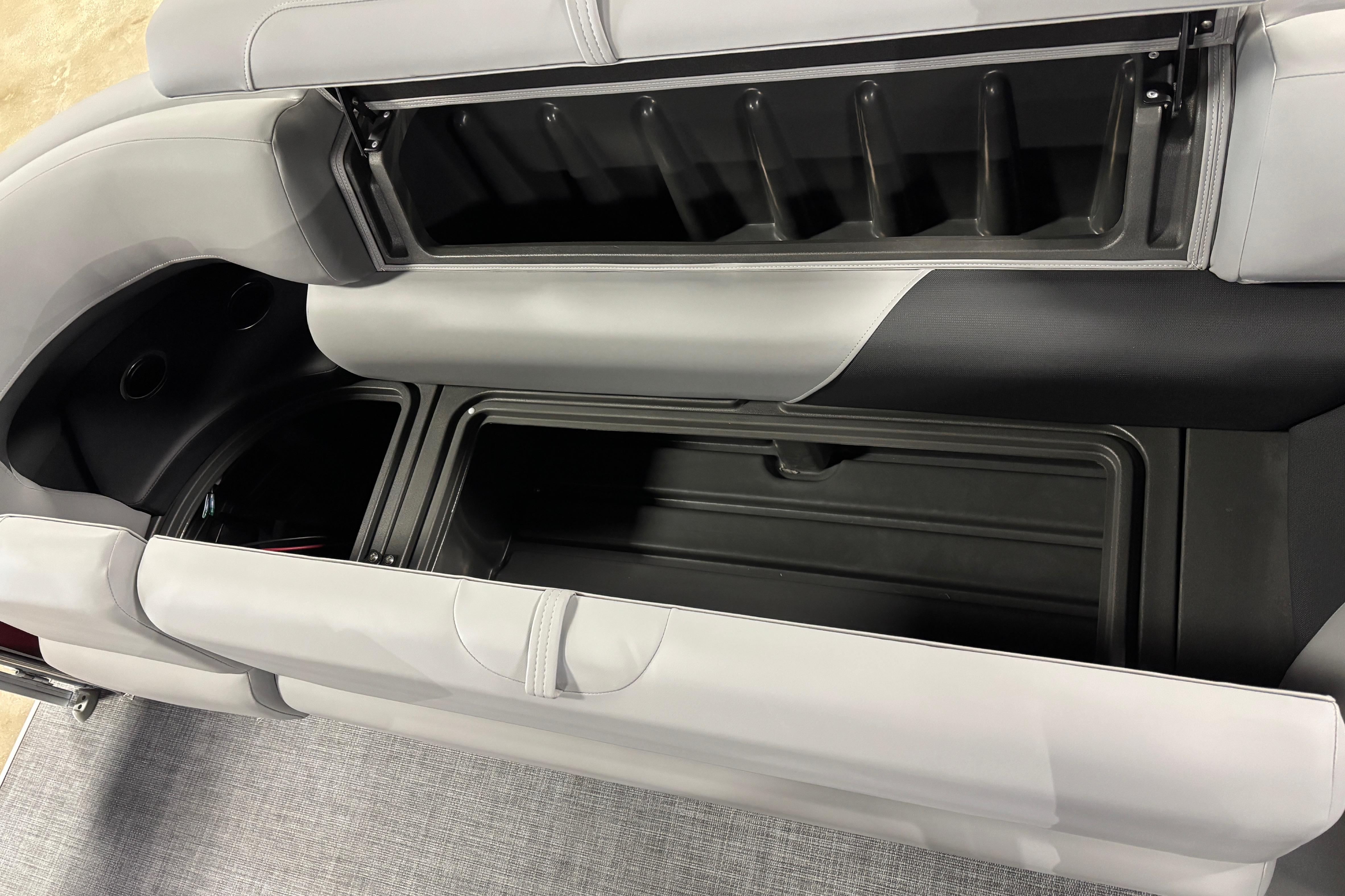 Interior storage compartments of 2026 Sun Tracker SportFish 20 DLX boat, featuring sleek design.