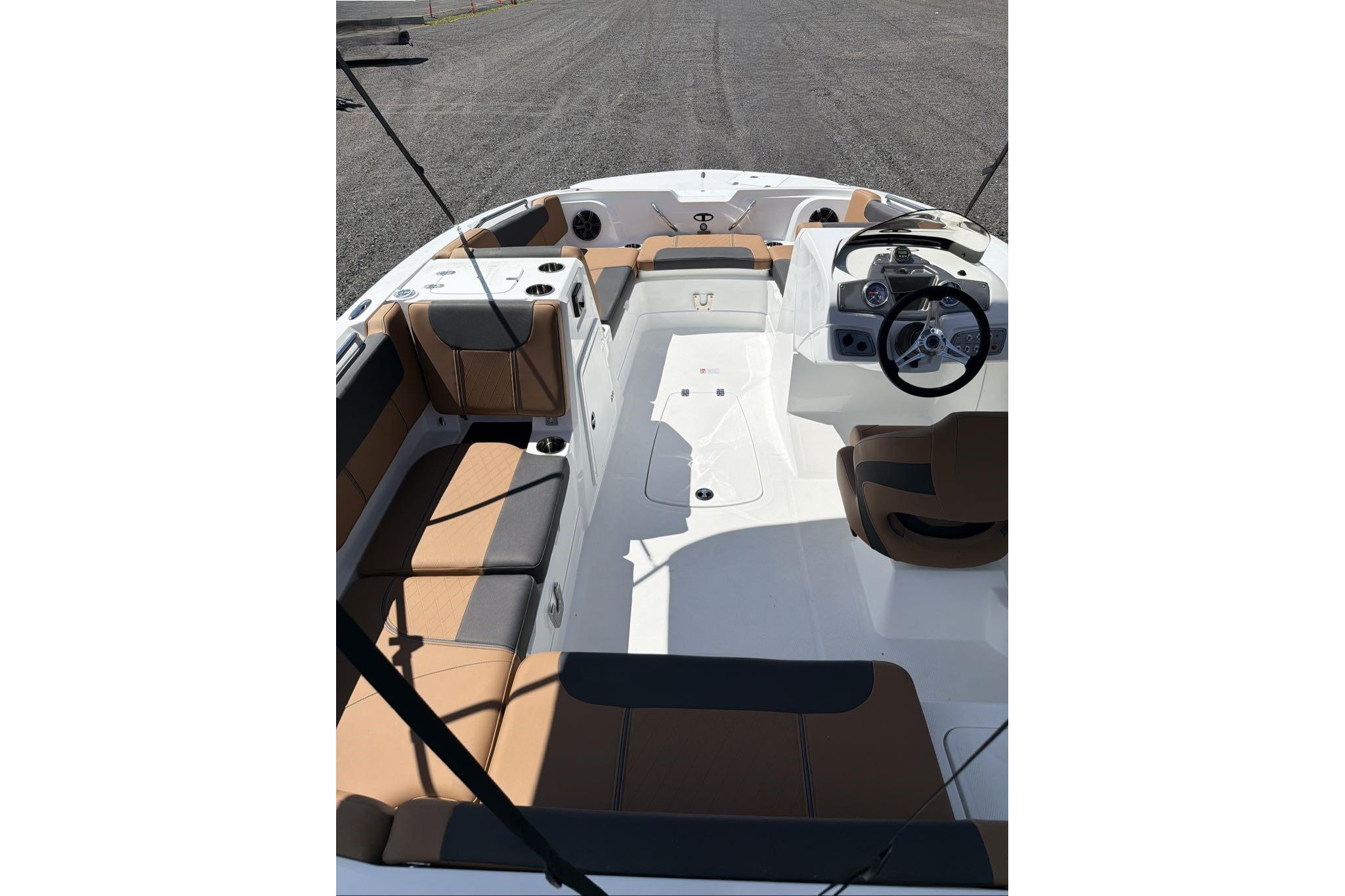 2026 Tahoe 1950 boat interior with tan seating and modern dashboard.