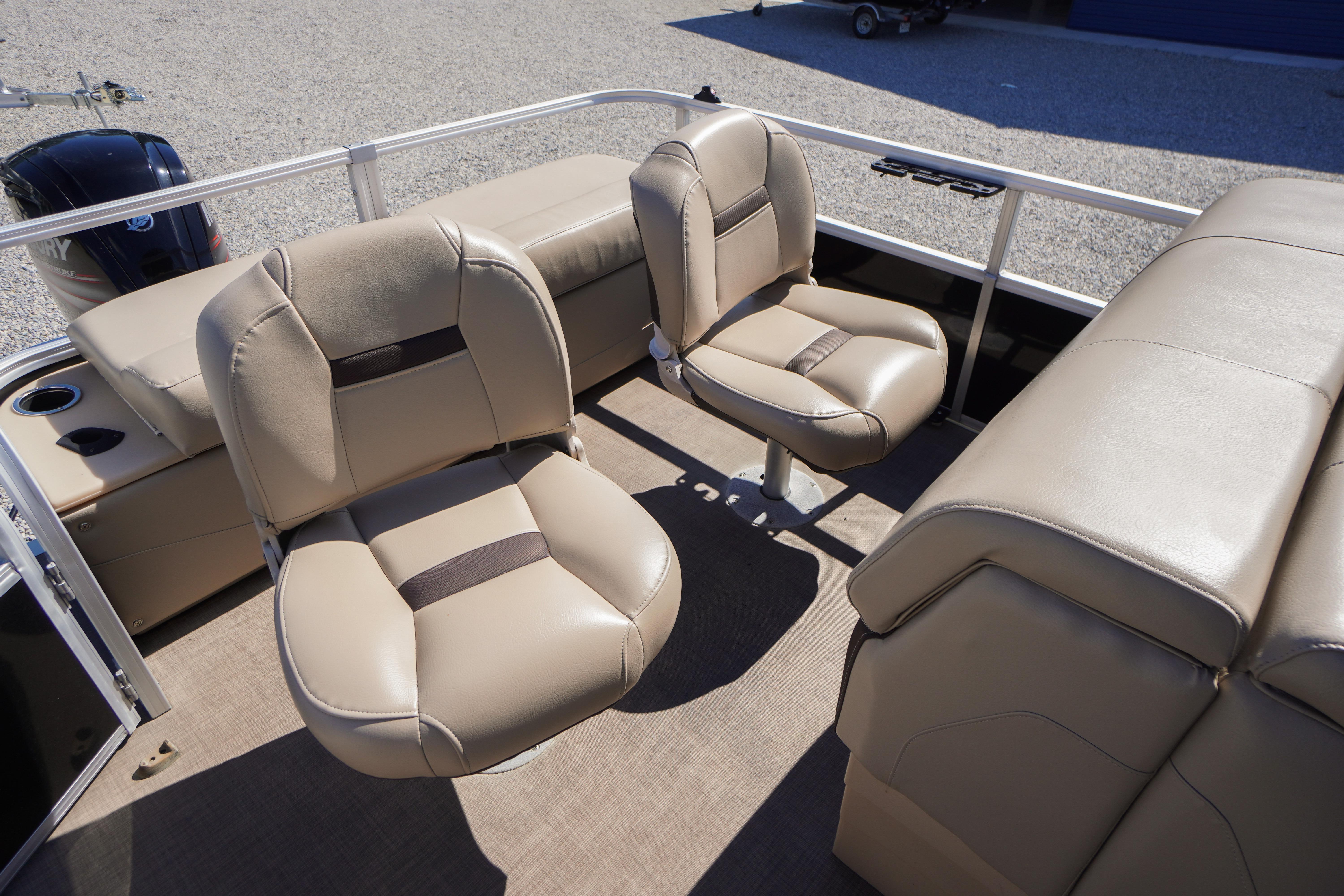 2019 SUNTRACKER Fishin' Barge 22 DLX interior with beige seating and spacious layout.