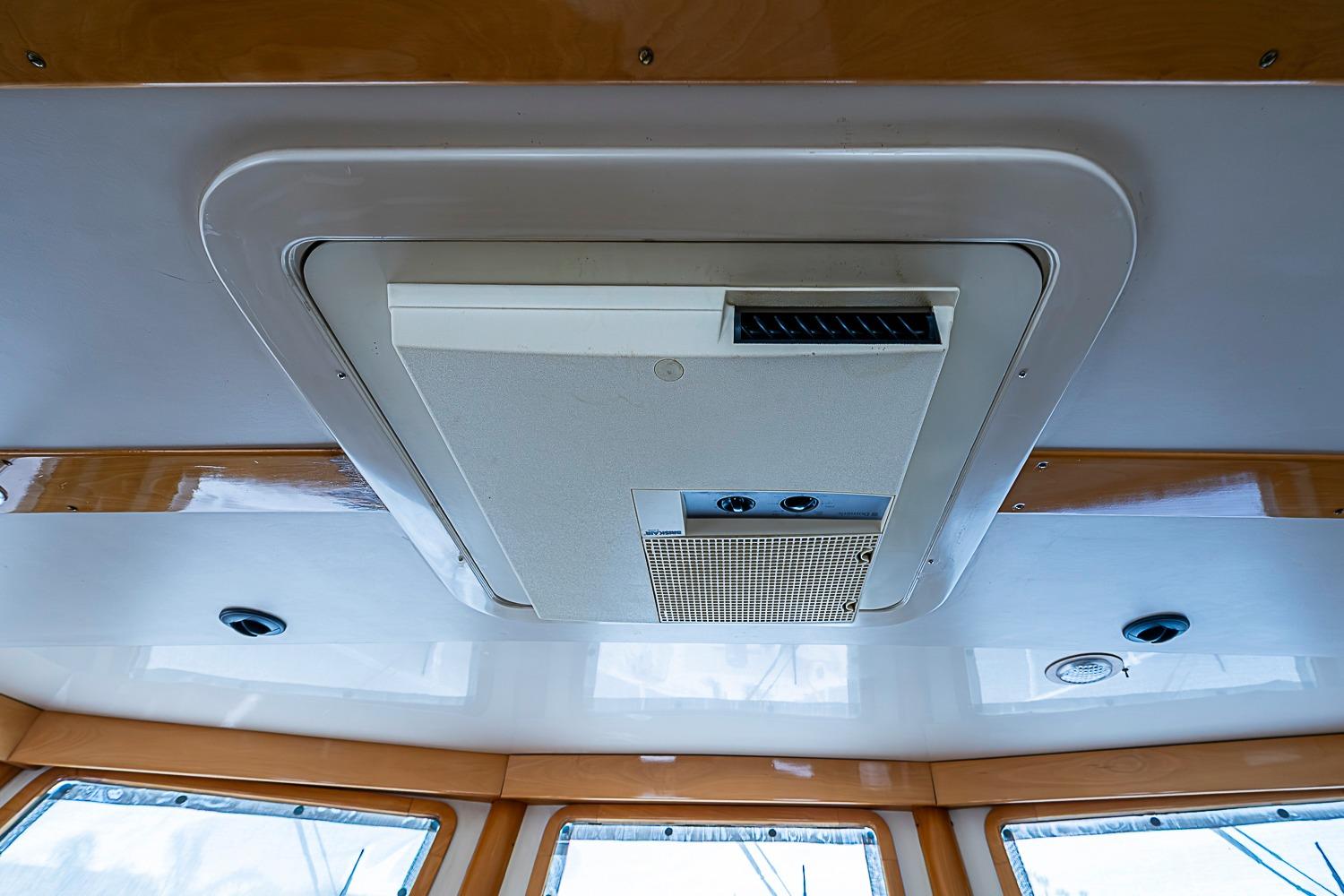 Ceiling view of 2003 Magna Marine Nova Scotia 47 boat interior with air vent system.