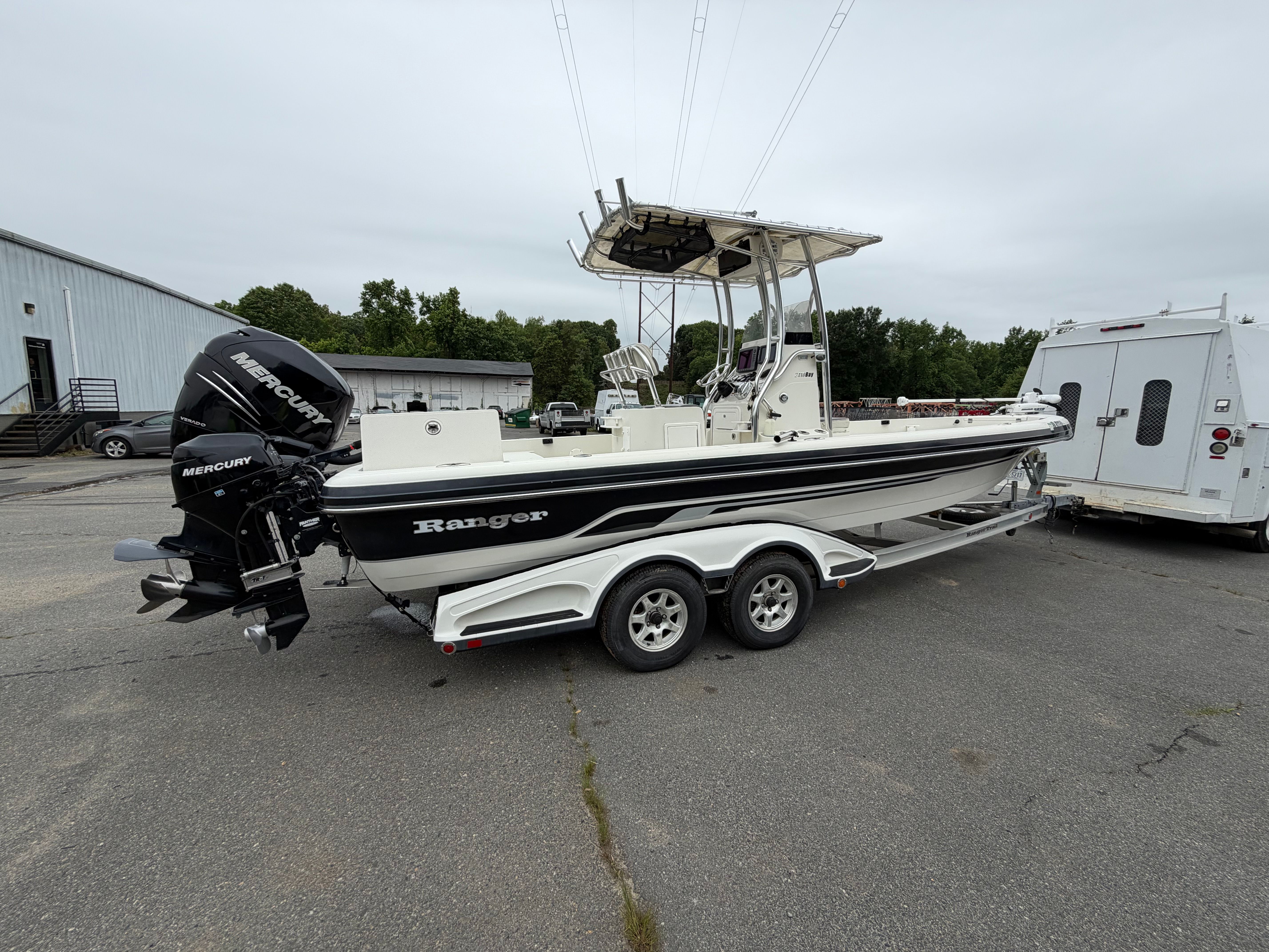 2008 Ranger 2400 Bay Ranger boat on trailer outdoors.