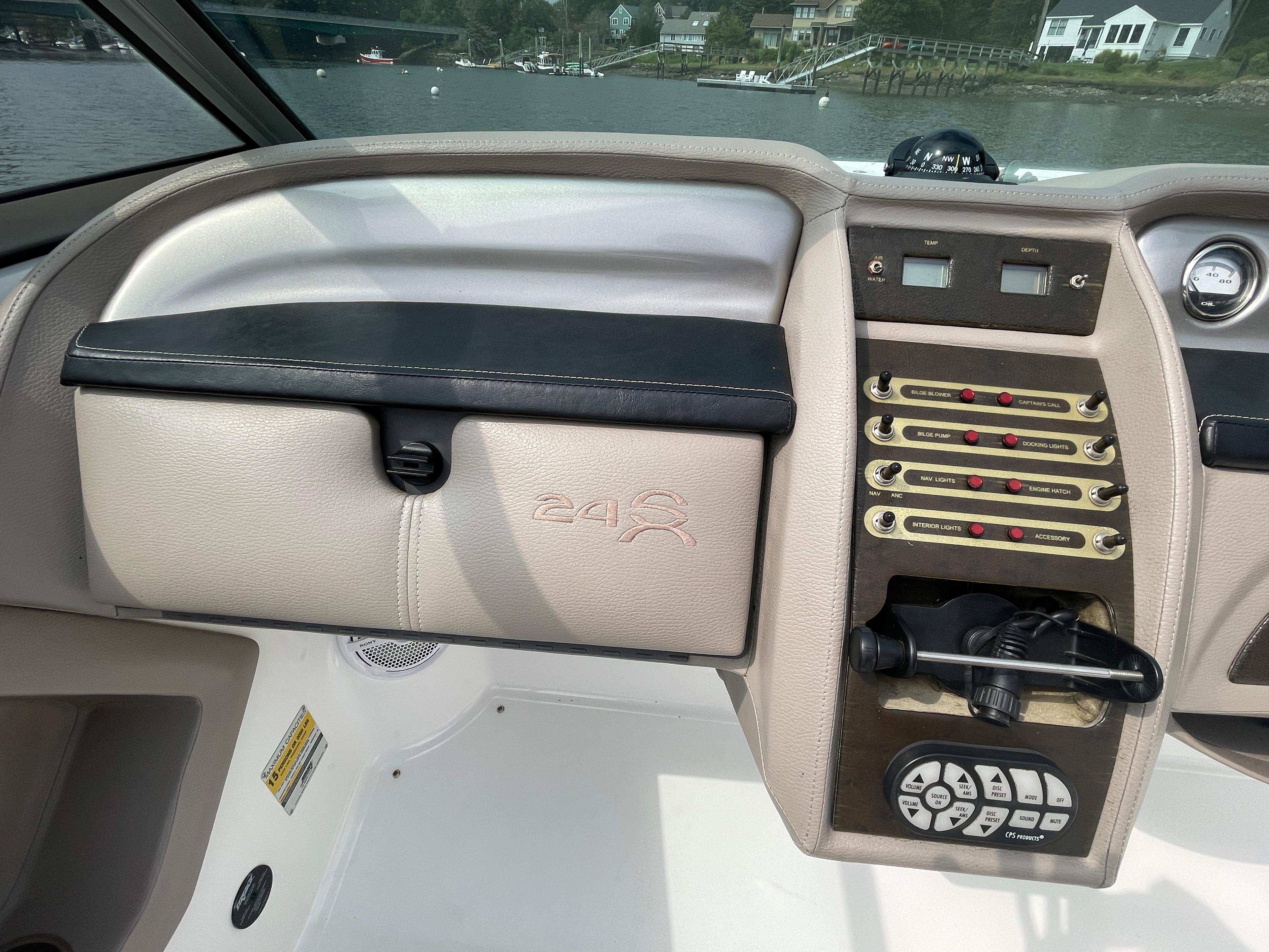 2006 Cobalt 24SX boat dashboard with control panel and glove compartment.