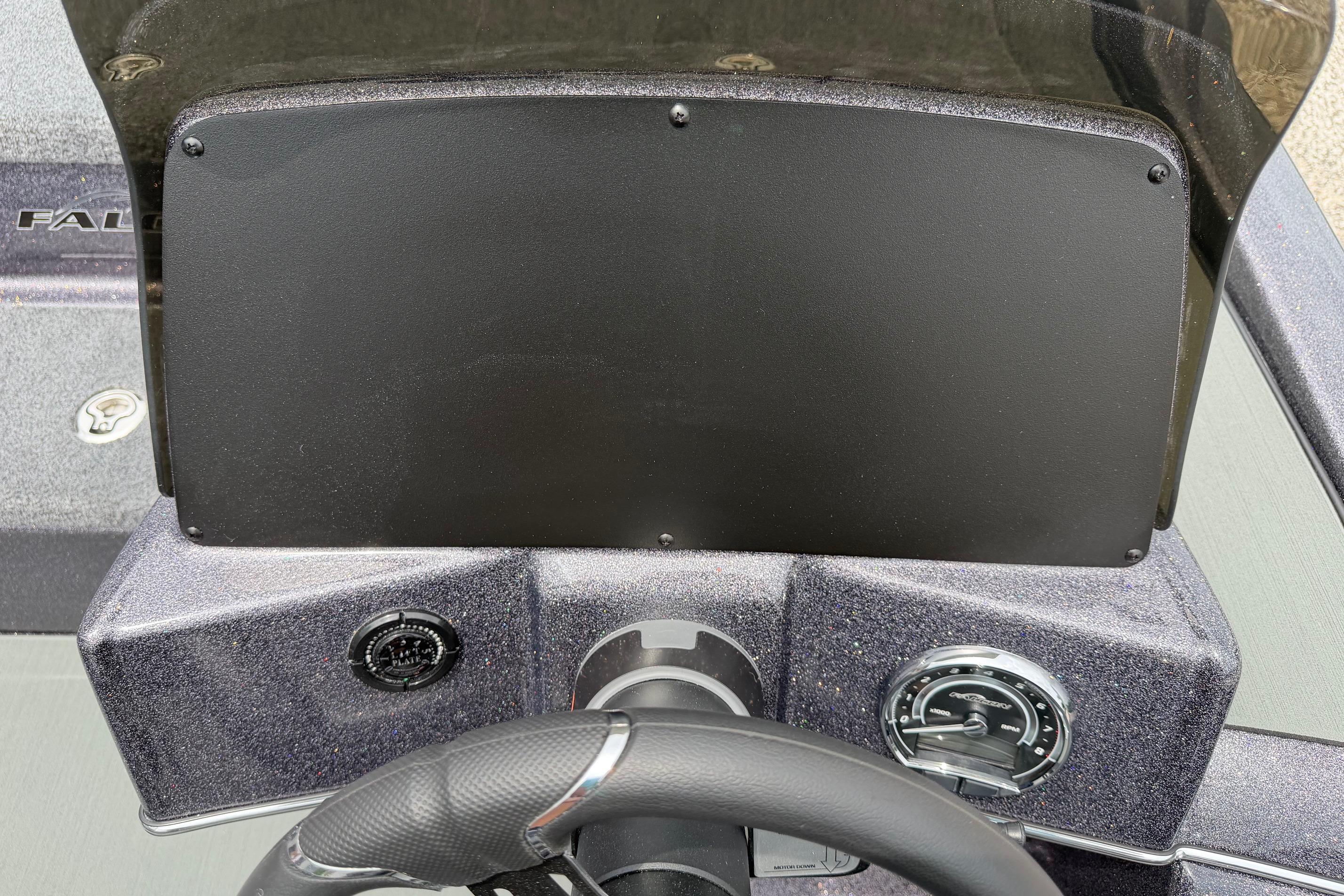 Dashboard of 2027 Falcon Boats F215 with steering wheel and gauges.