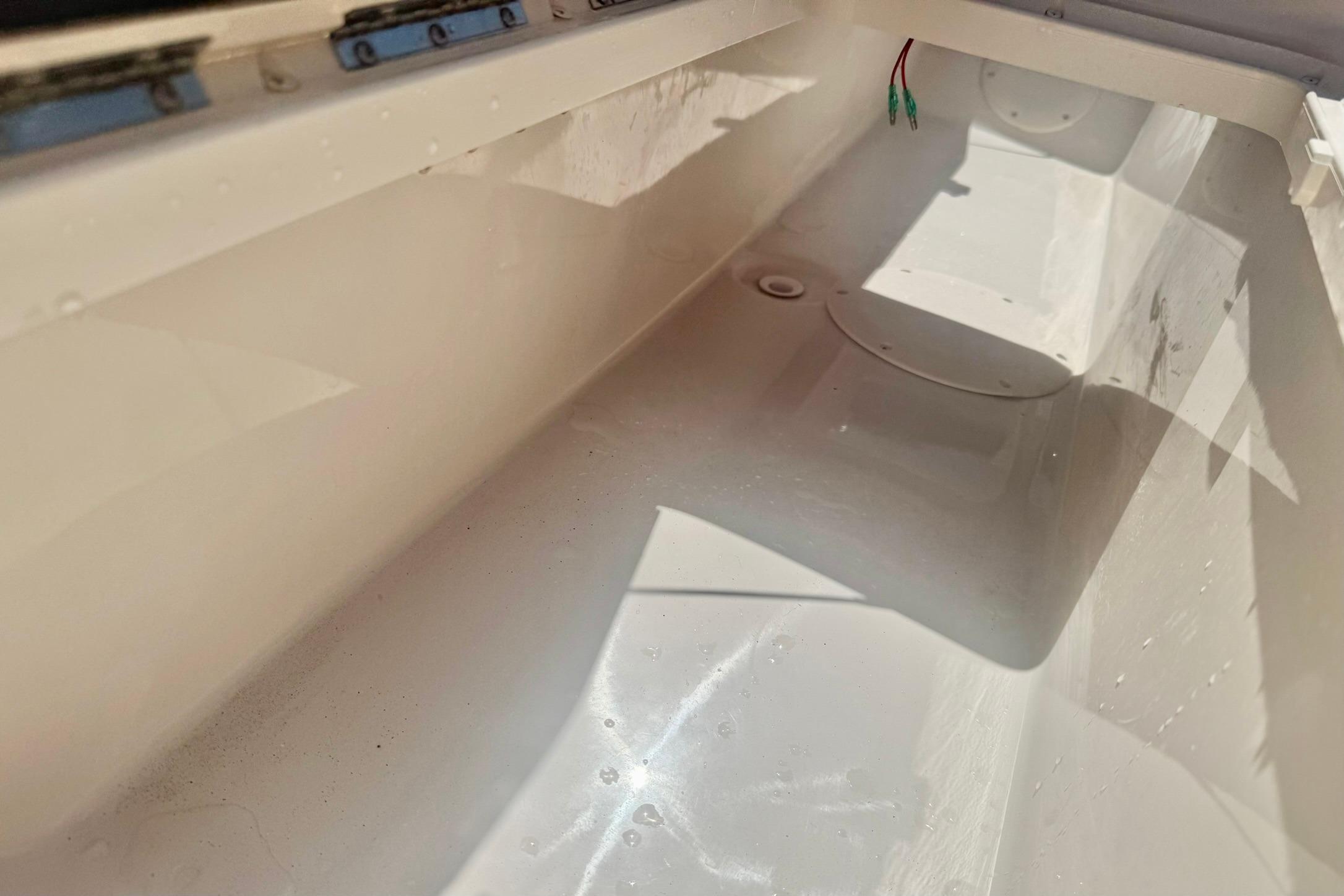 Interior view of a 2026 Carolina Skiff 21 Ultra Elite boat compartment.