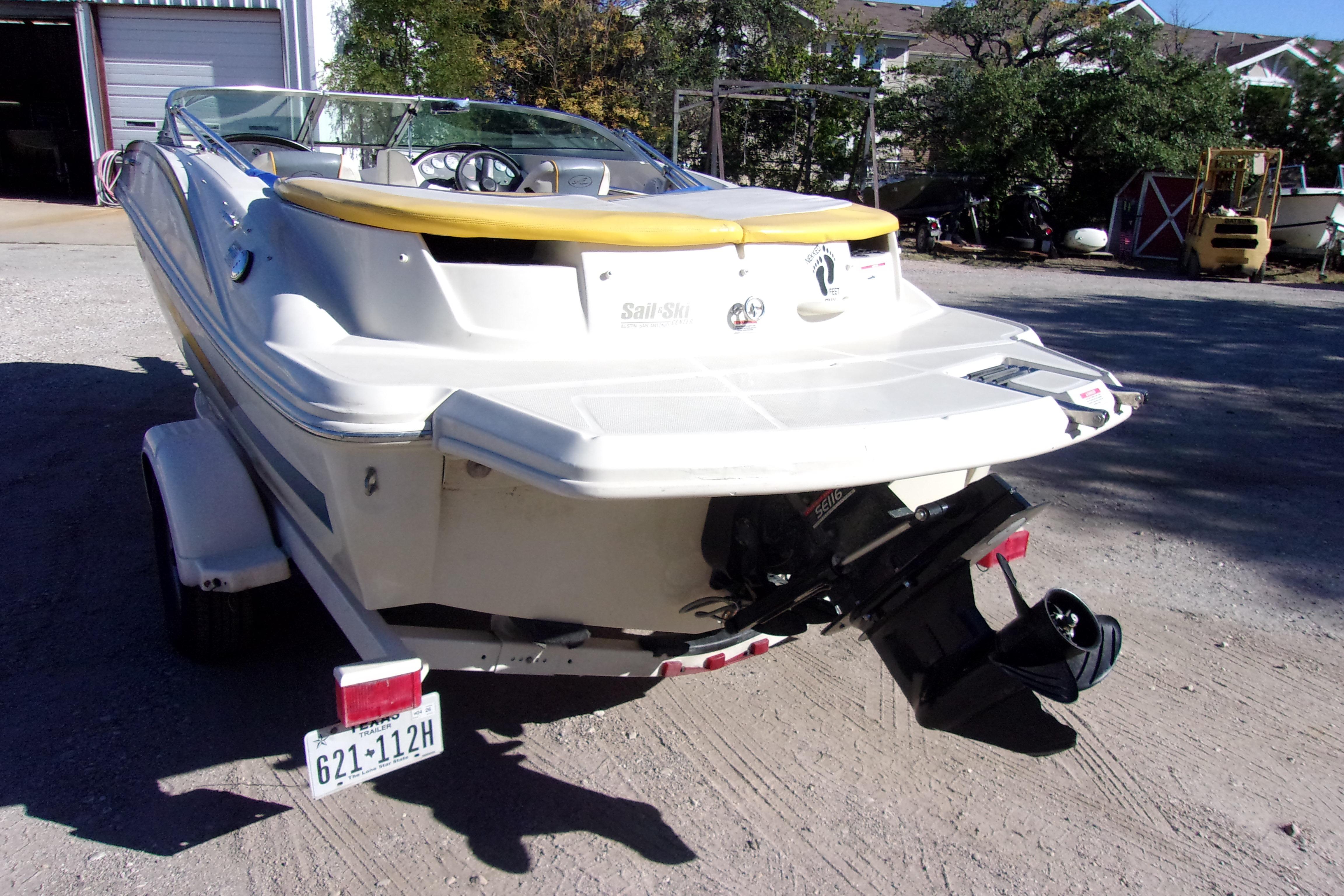 2007 Sea Ray 185 Sport boat on trailer, rear view, outdoors.