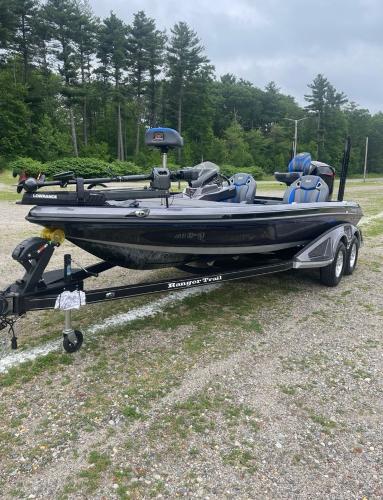 2025 Ranger Z520R boat on trailer, parked outdoors with trees in background.