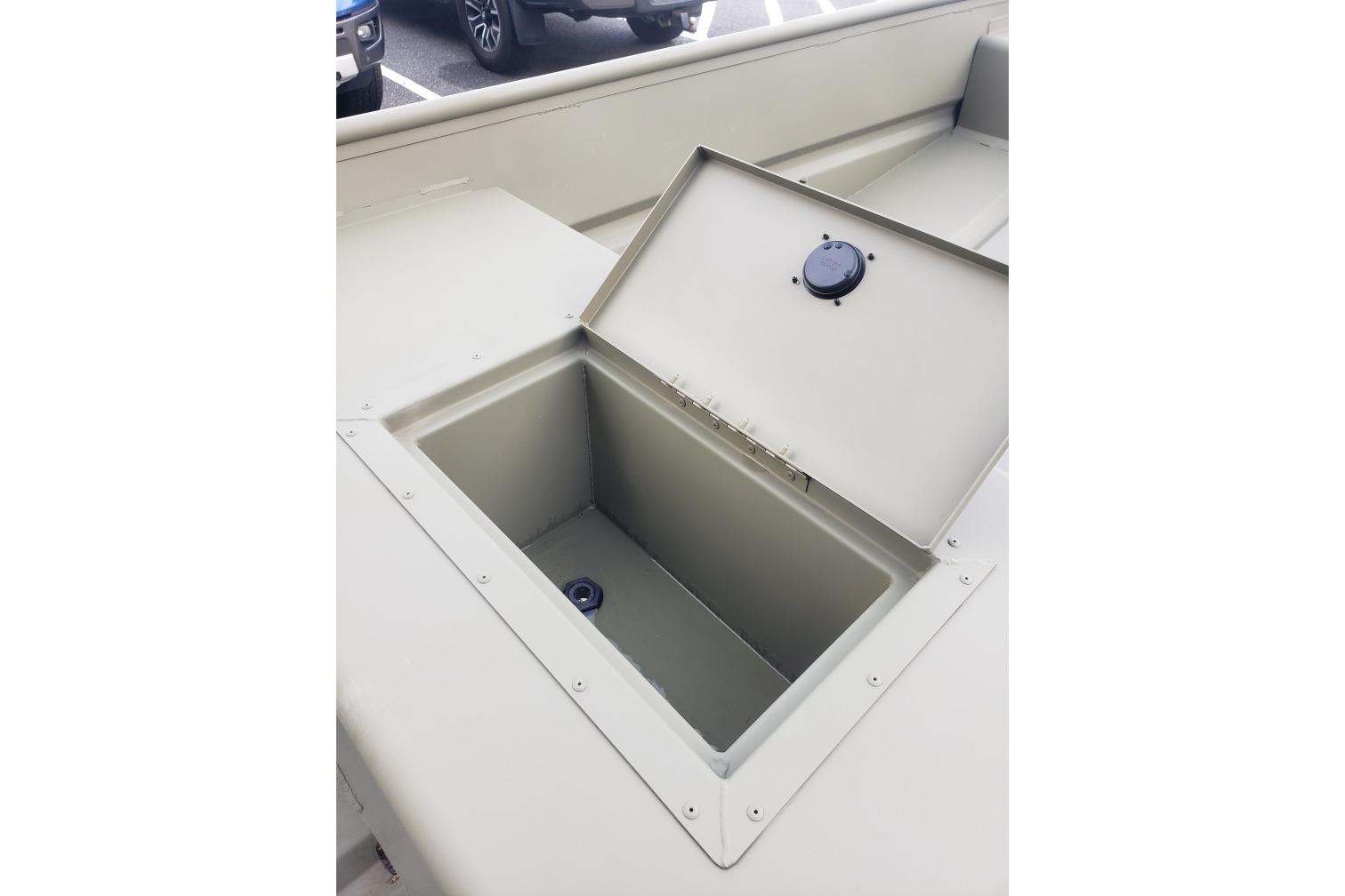 Open storage compartment in 2026 Tracker Grizzly 15 Jon boat, showcasing interior space.