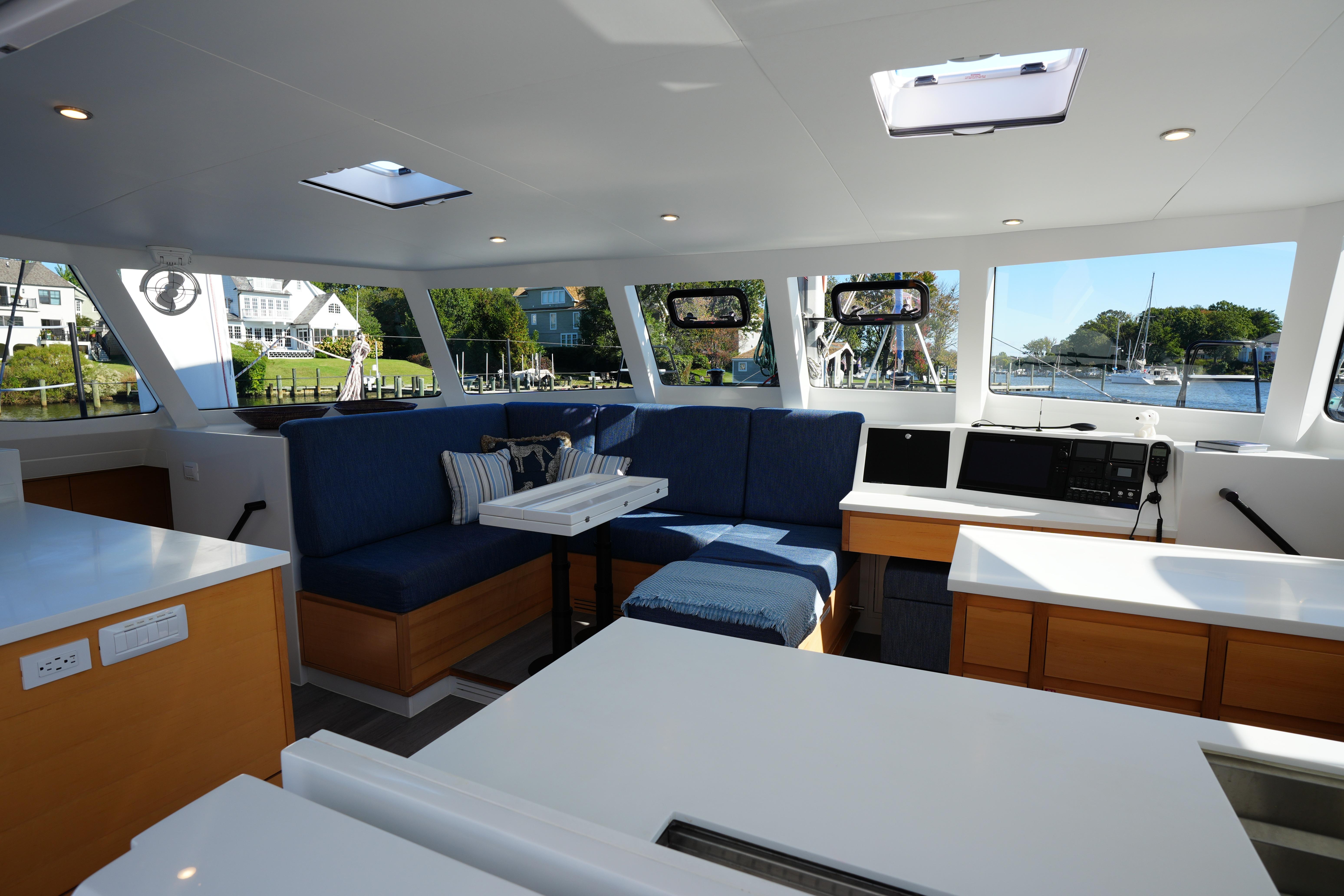 Luxurious interior of 2024 Balance 442 yacht with modern seating and scenic views.