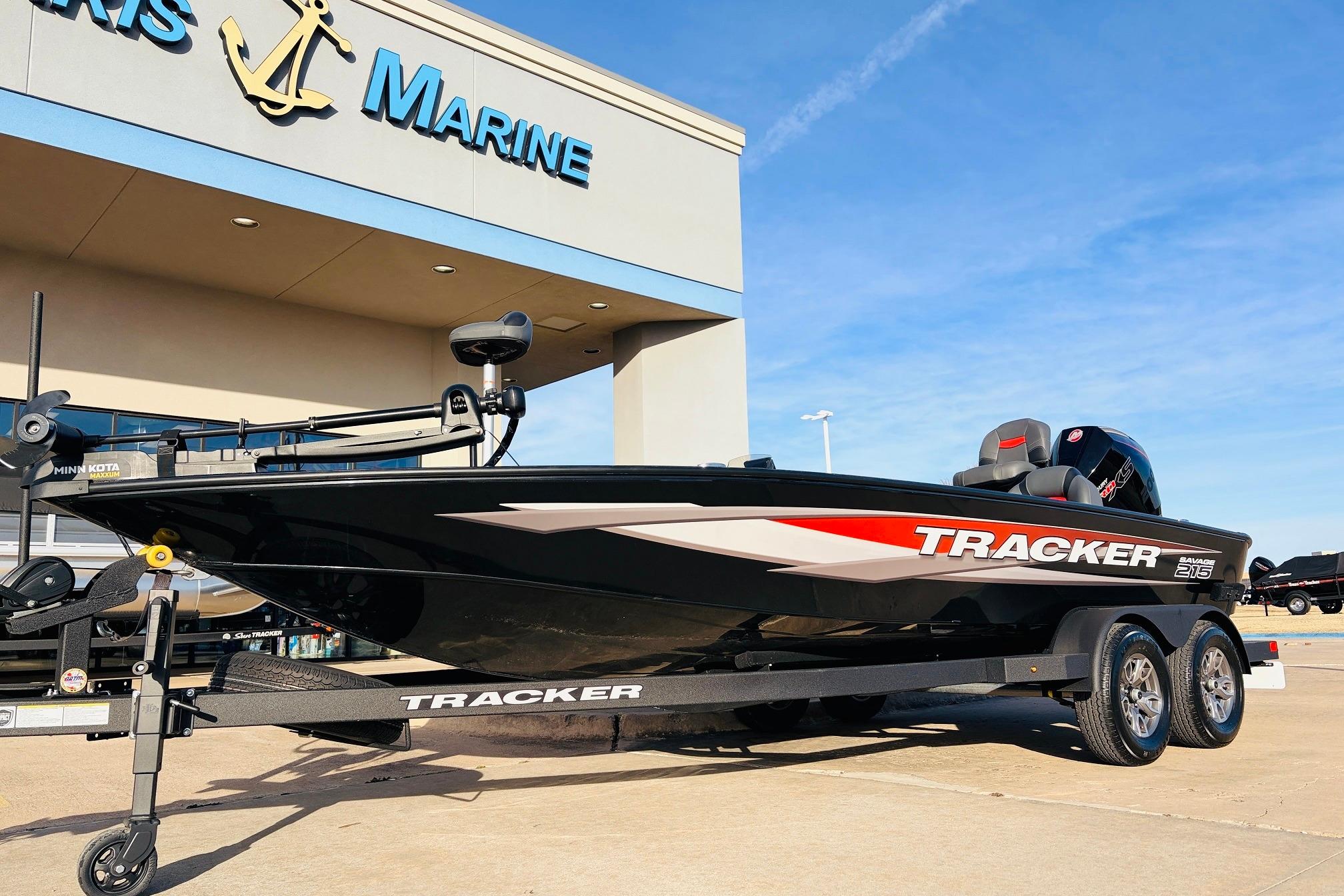 2025 Tracker Savage 215 boat on trailer outside marine dealership.