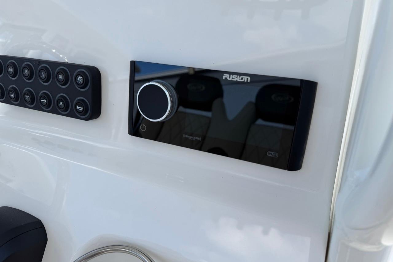 Control panel on 2026 Key West 239 FSR boat dashboard with Fusion audio system.
