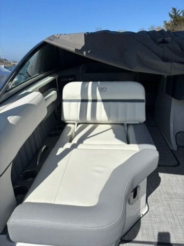 Interior of a 2020 Cobalt SC23 boat with white leather seating.