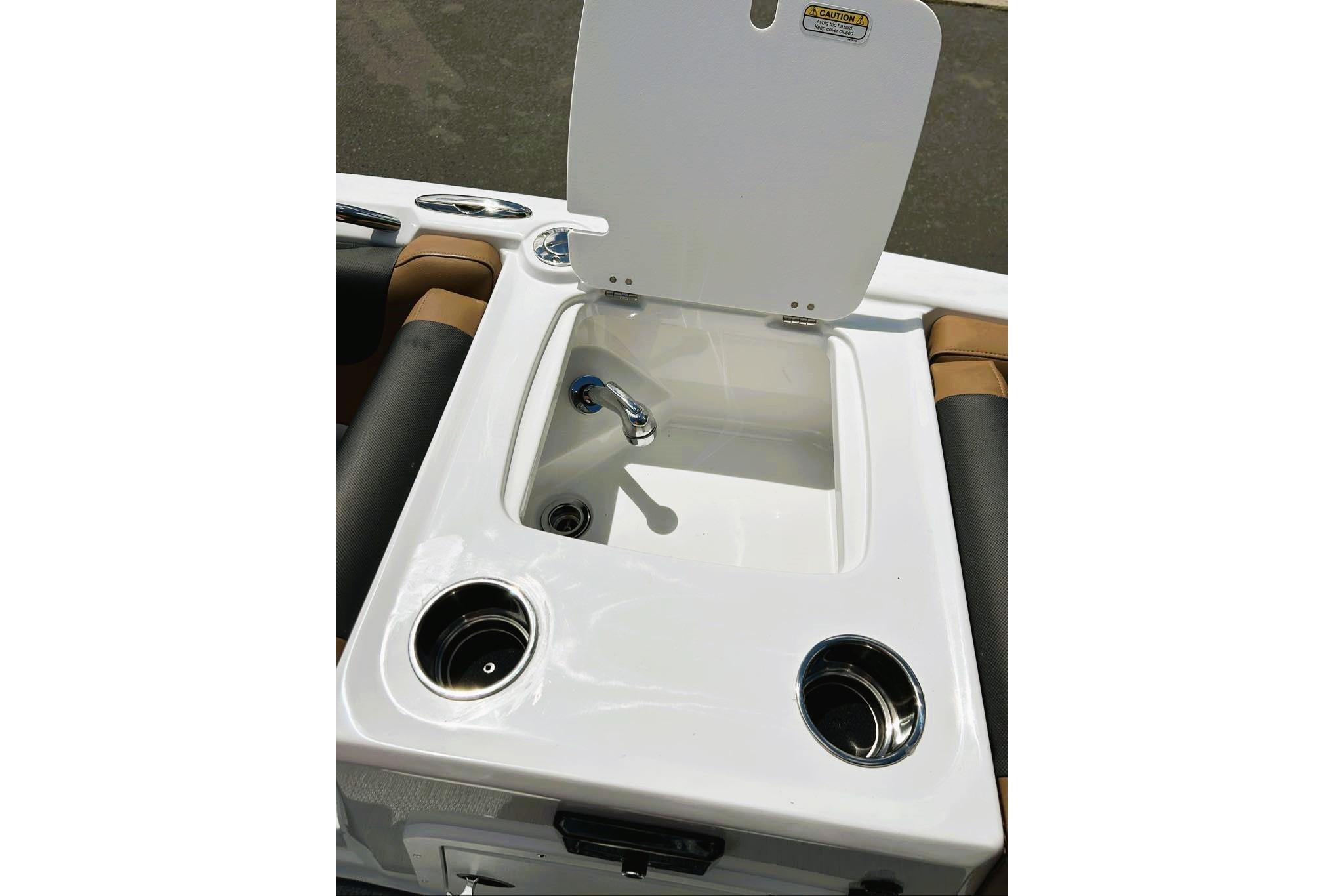 2026 Tahoe 2150 boat sink with cup holders and faucet.
