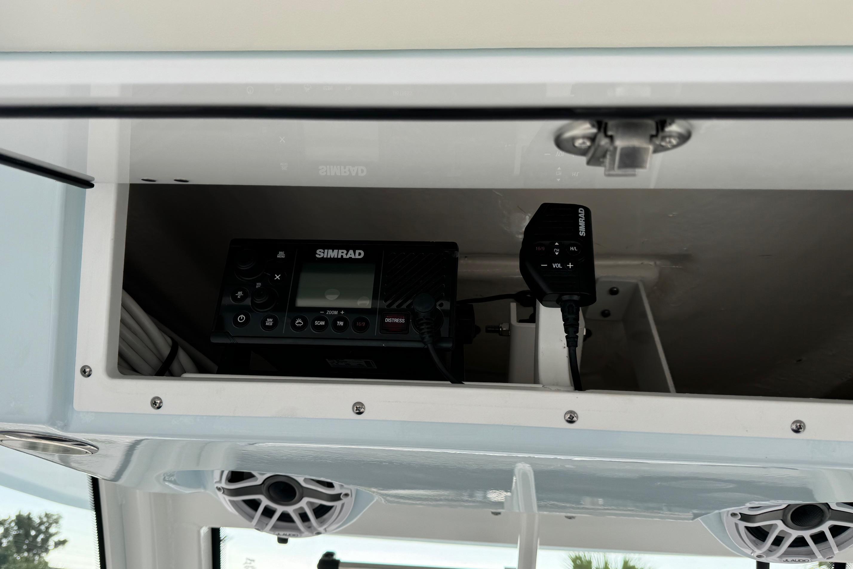 2025 Robalo R360 Center Console with Simrad marine electronics in storage compartment.