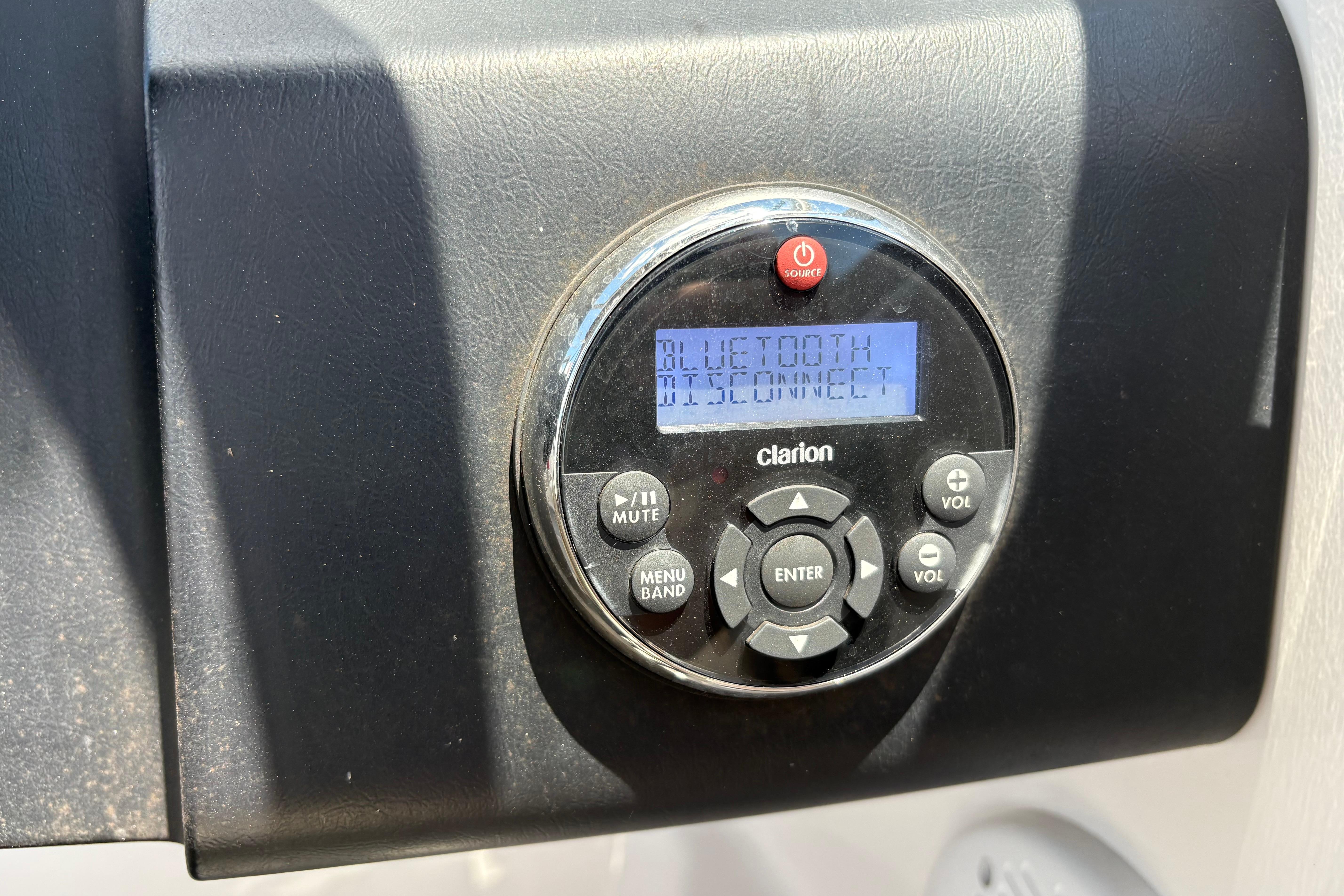 Clarion Bluetooth stereo system on 2008 Regal 1900 Bowrider boat dashboard.