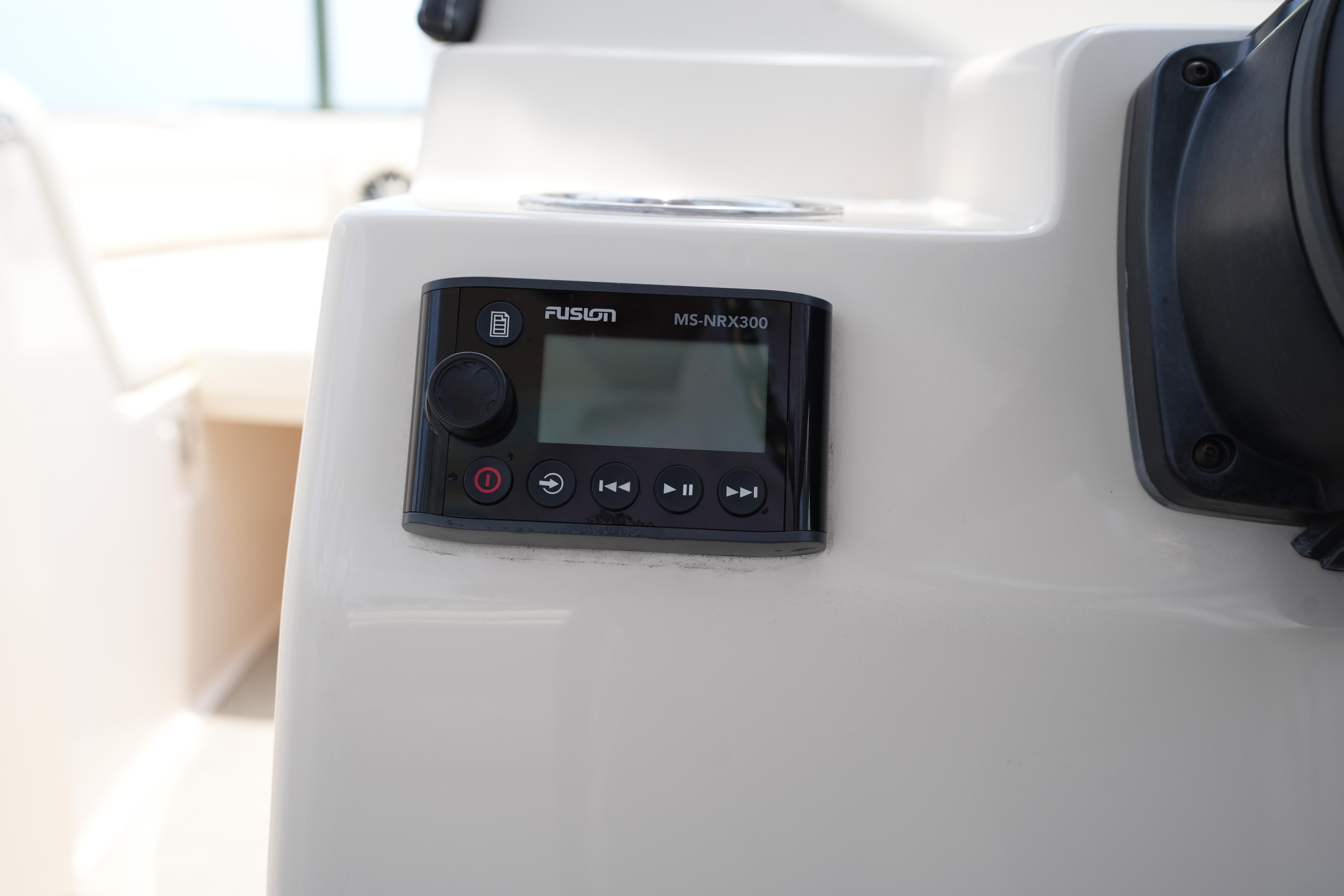 Fusion MS-NRX300 audio system on 2021 Grady-White Freedom 235 boat dashboard.