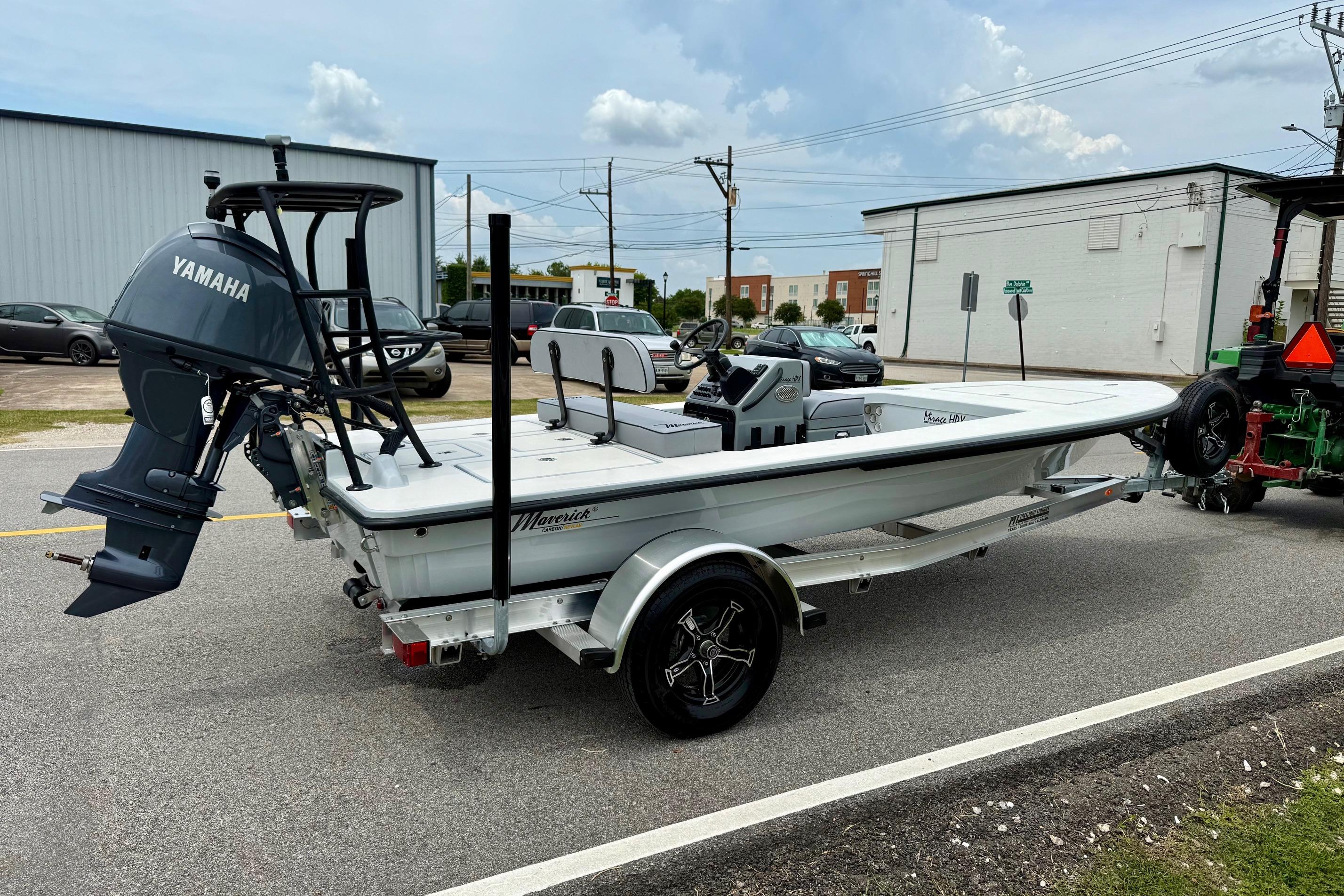 2026 Maverick 17 HPX-S boat on trailer with Yamaha outboard motor, parked on street.