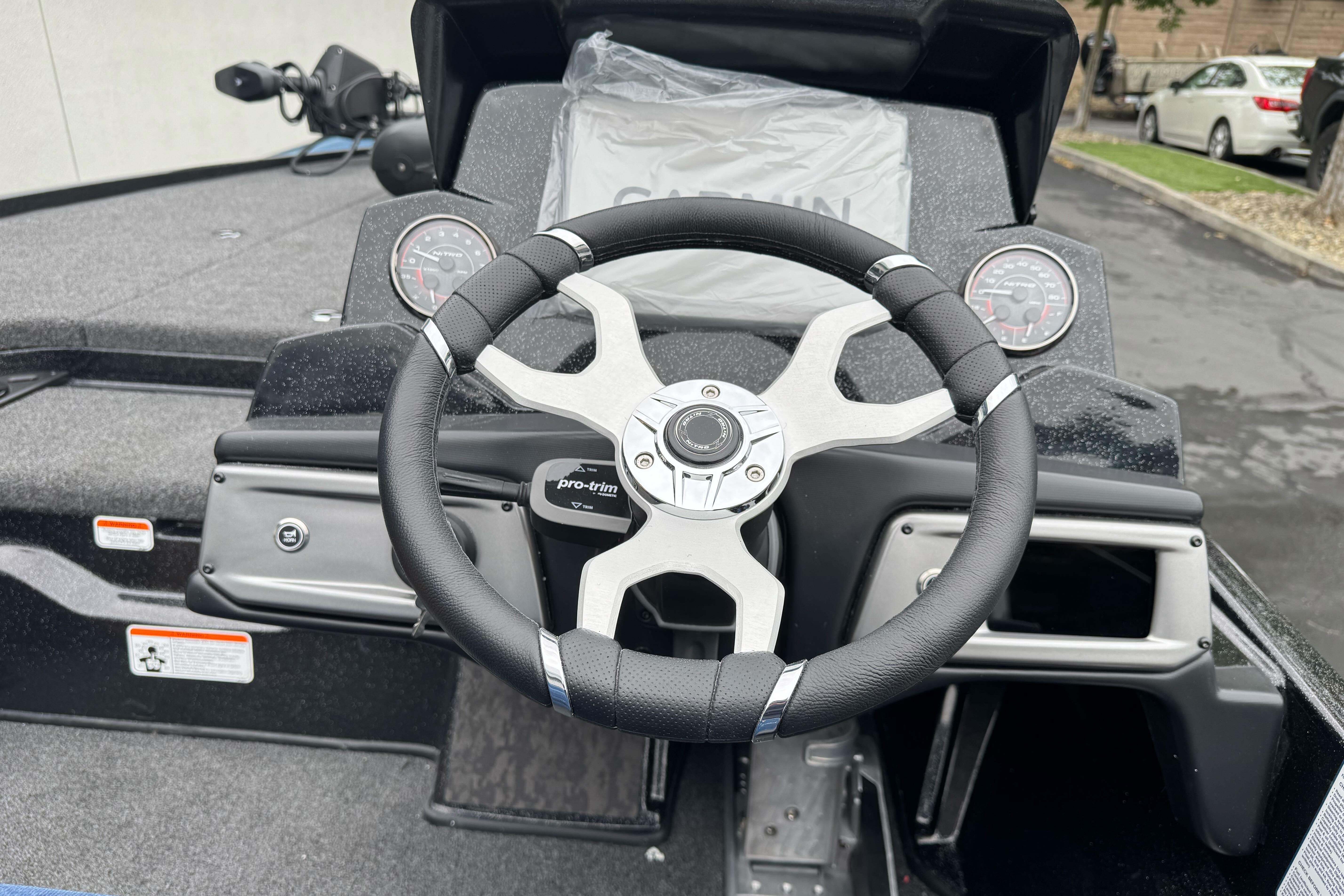 Steering wheel of 2026 Nitro Z20 XL Pro boat, featuring modern dashboard design.