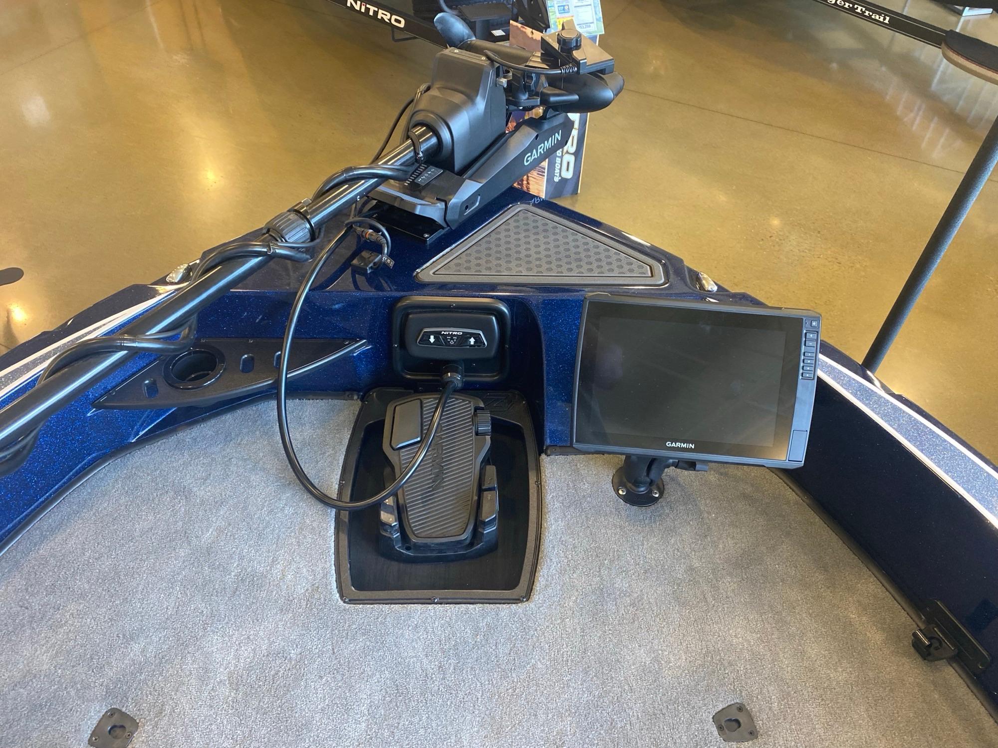 2025 Nitro ZV20 Pro boat dashboard with Garmin display and foot pedal controls.