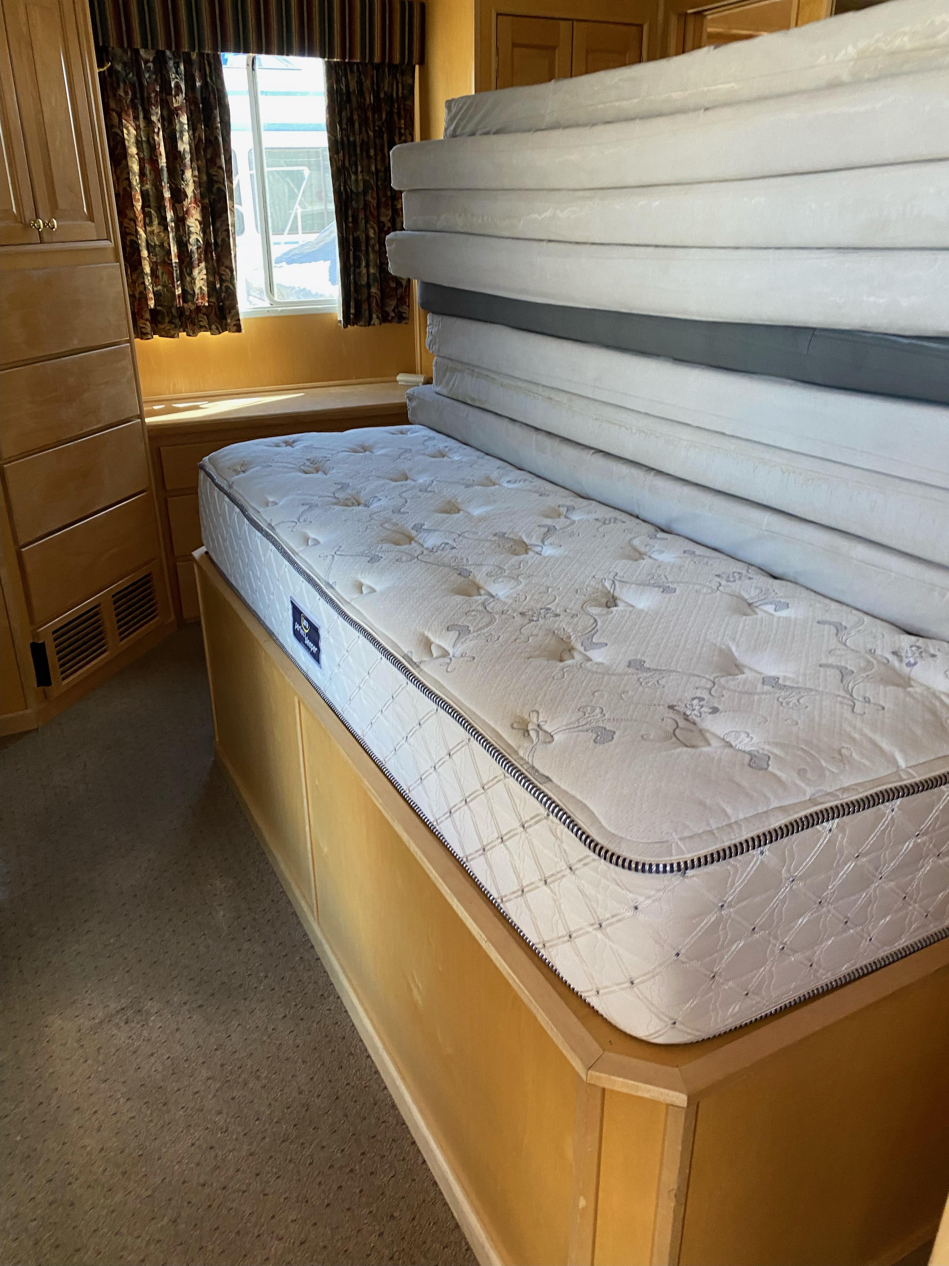 2003 Stardust Cruisers Red Rock Retreat Week 26 interior with stacked mattresses.