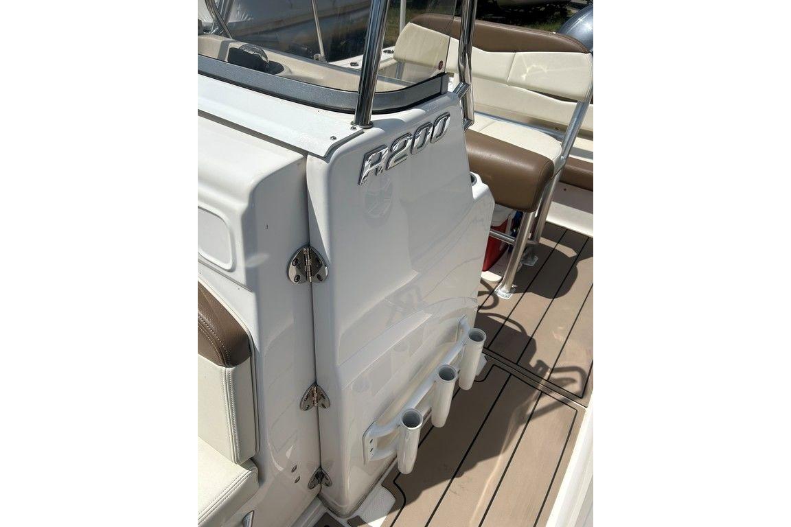 2017 Robalo R200ES boat interior with seating and rod holders.