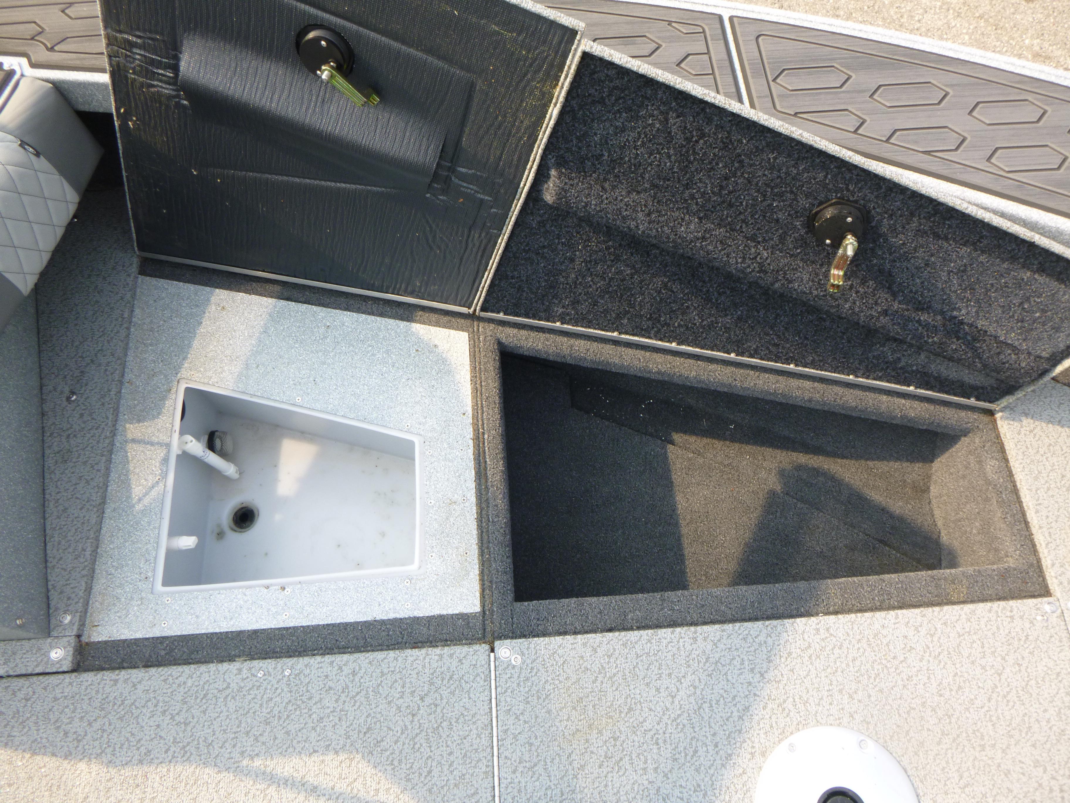 Interior compartments of 2025 KingFisher 2125 Arrow Sport boat, featuring storage and utility spaces.