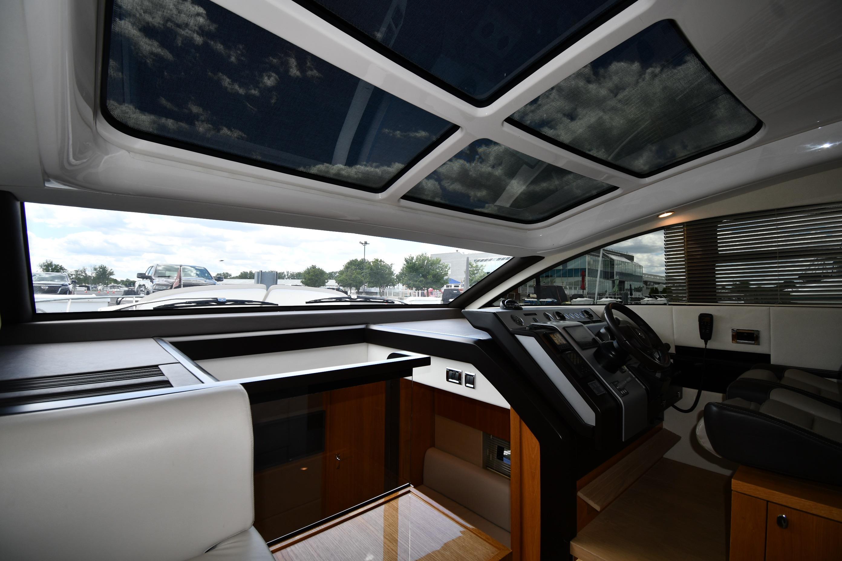 Interior view of 2024 Fairline G50 Targa yacht cockpit with panoramic sunroof.