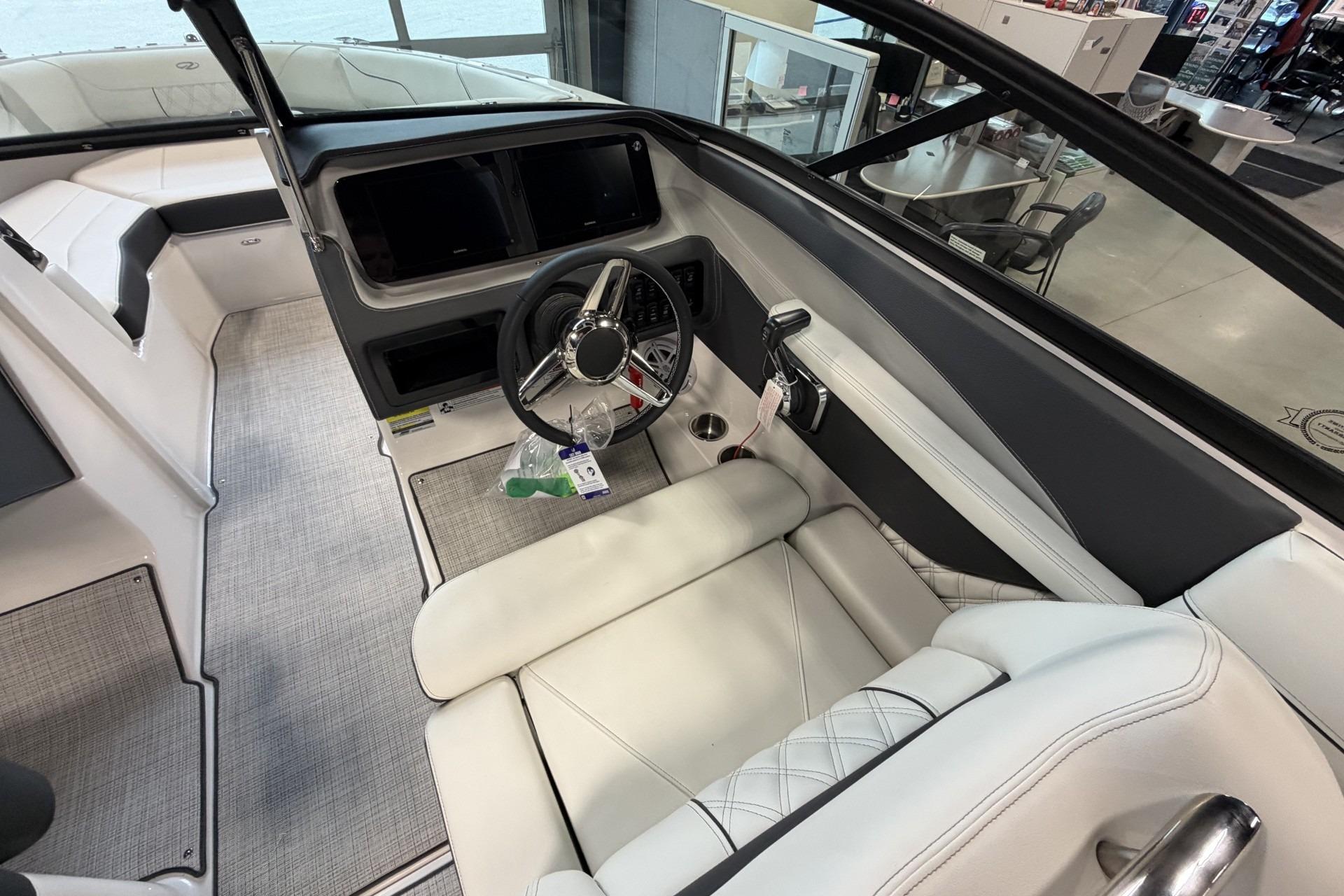 Interior of a 2027 Regal LS2 boat featuring a sleek steering wheel and modern dashboard.