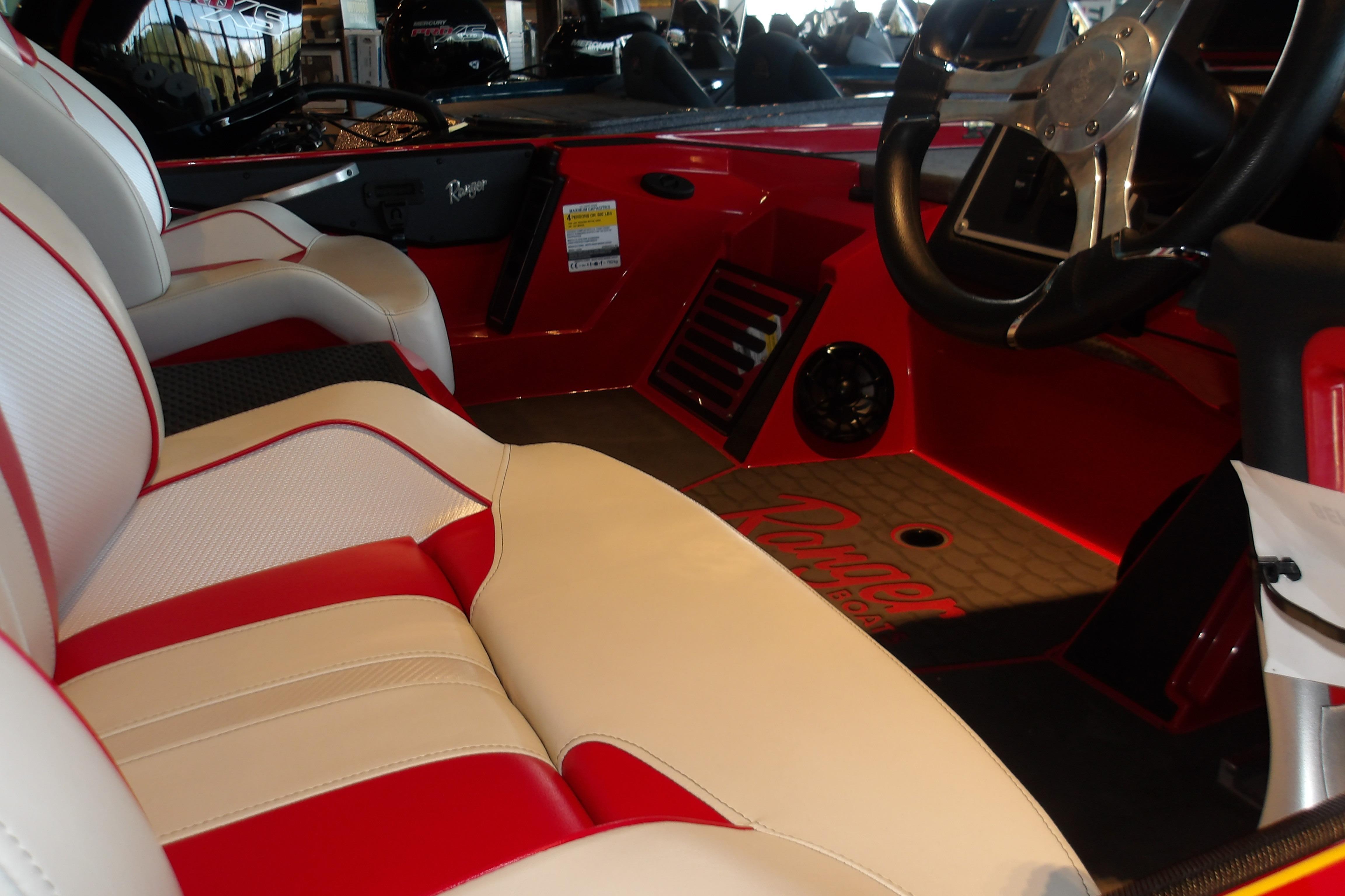 2025 Ranger Z519R Cup-Equipped boat interior with red and white seating and steering wheel.