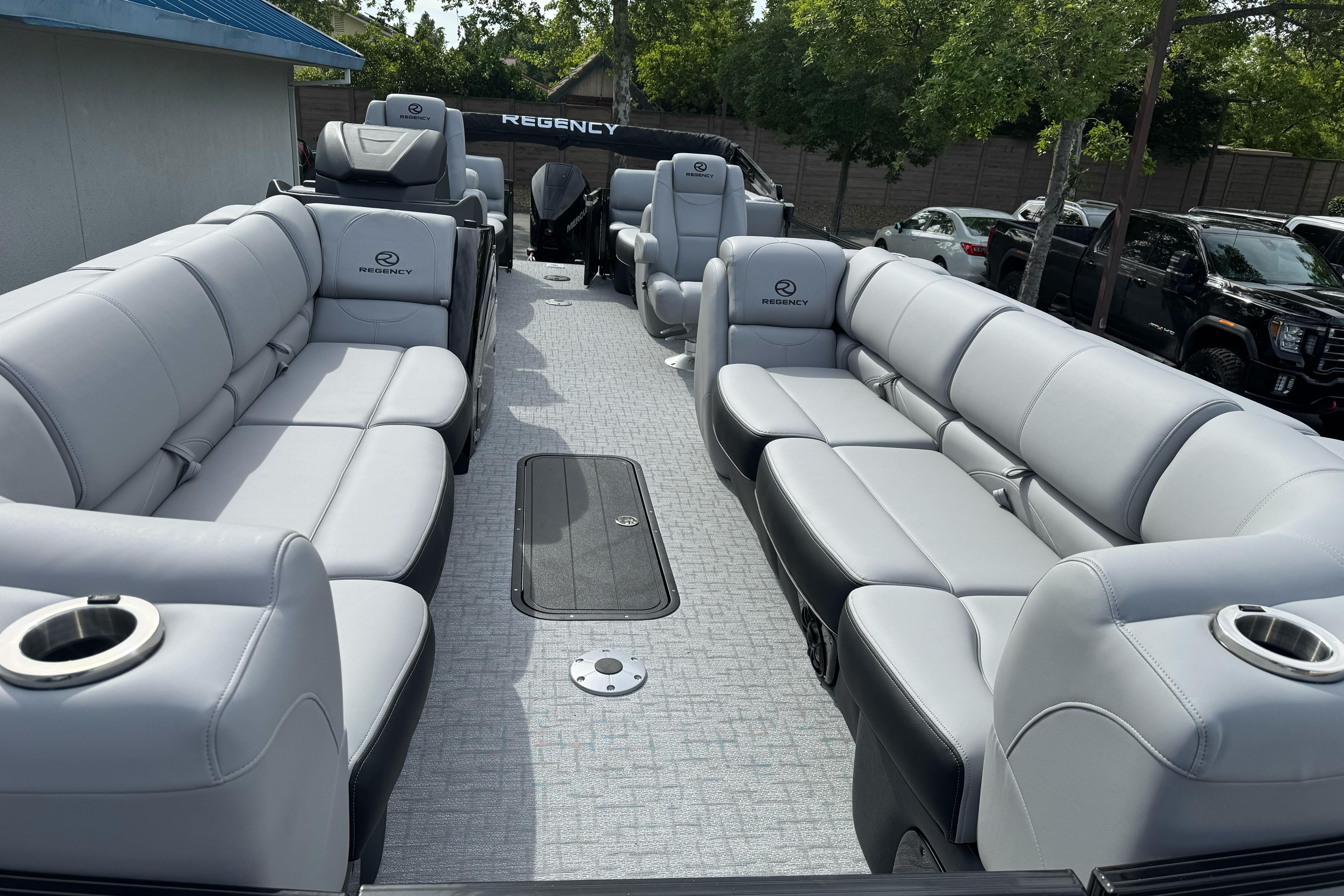 Luxurious 2026 Regency 250 DL pontoon boat with spacious seating and modern design.