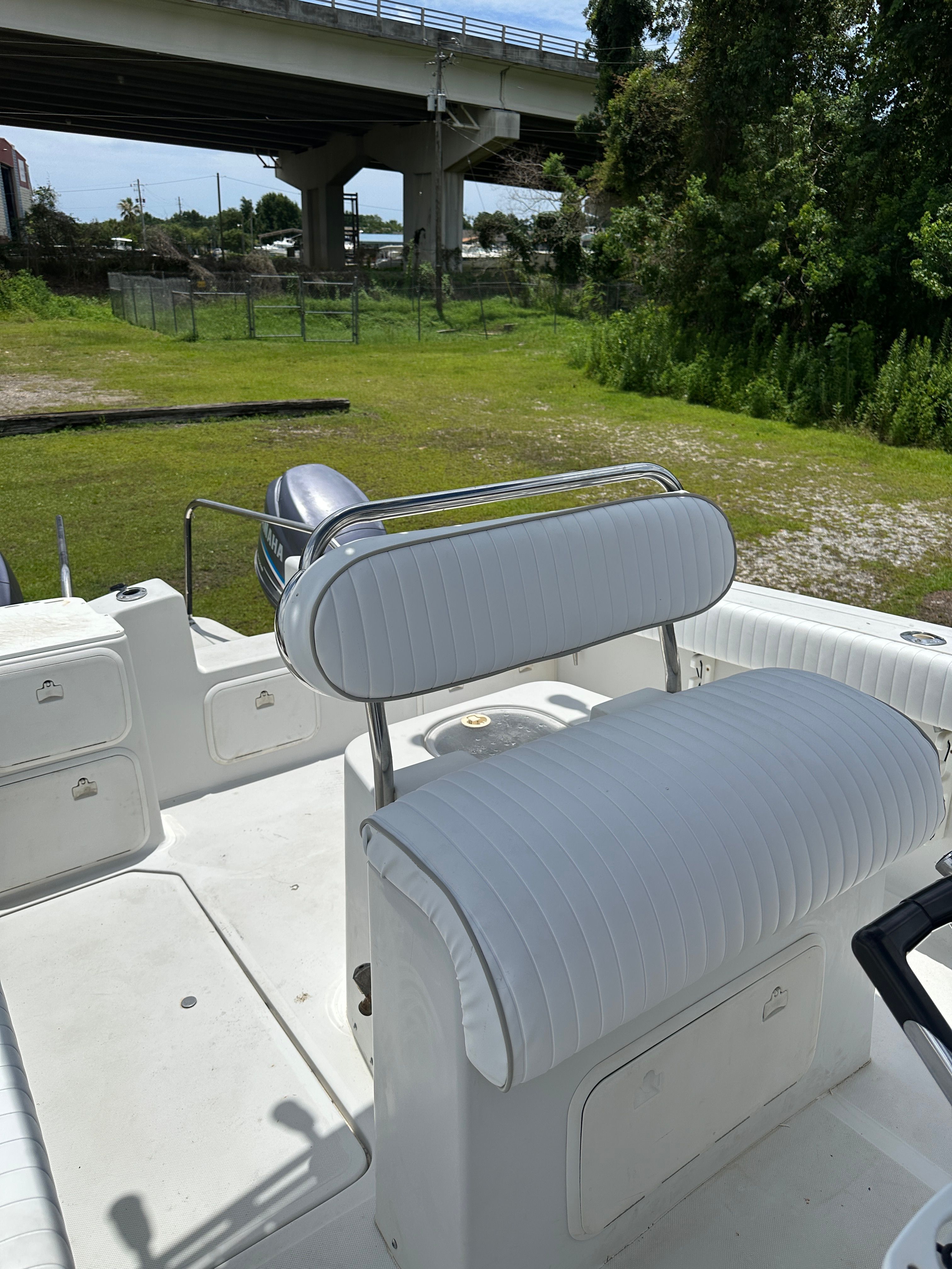The image shows the cockpit of a 1995 Glacier Bay 2260 Canyon Runner with white upholstery.
