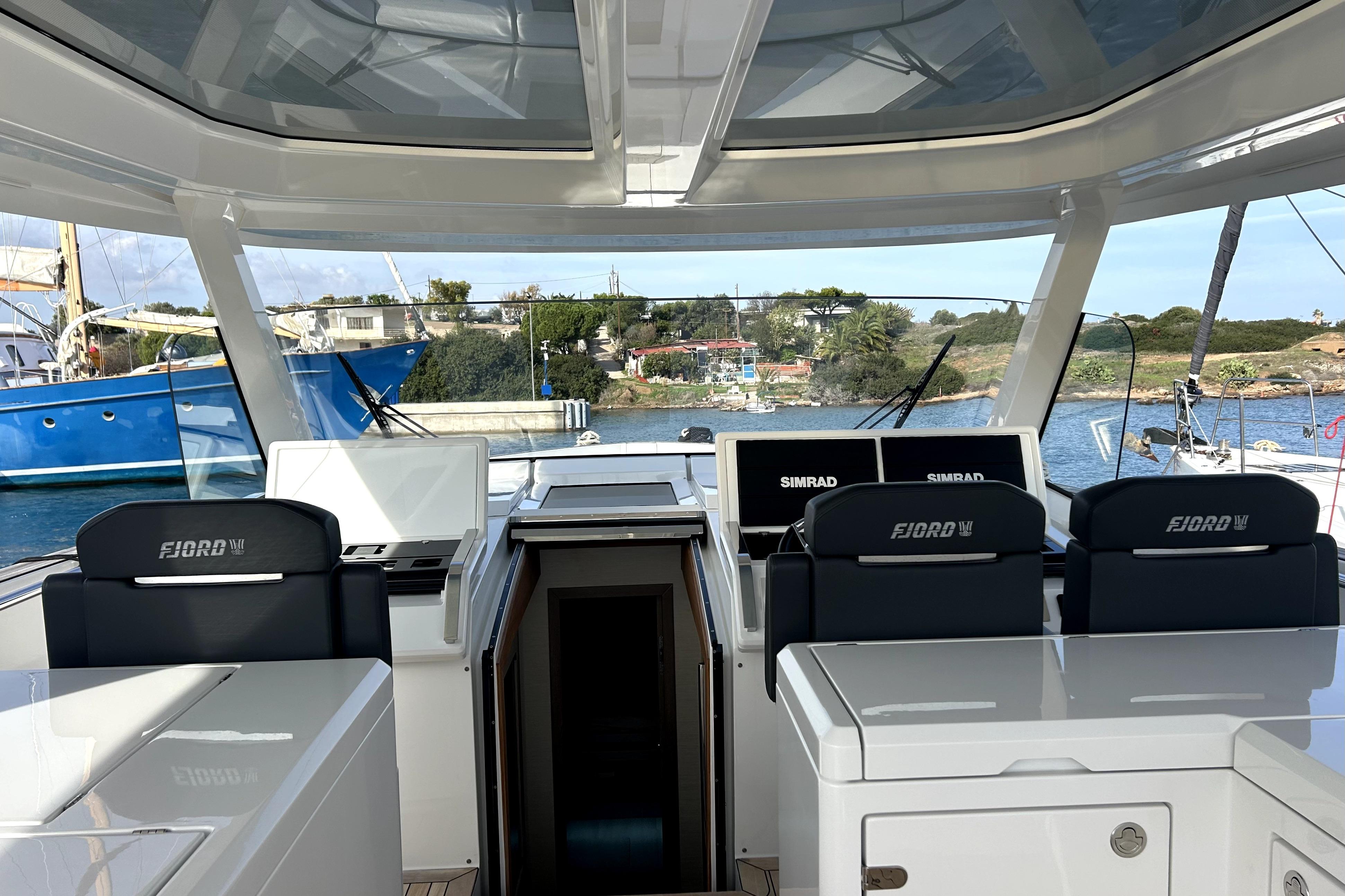 2023 Fjord 53 XL yacht interior with modern navigation equipment and sleek design.
