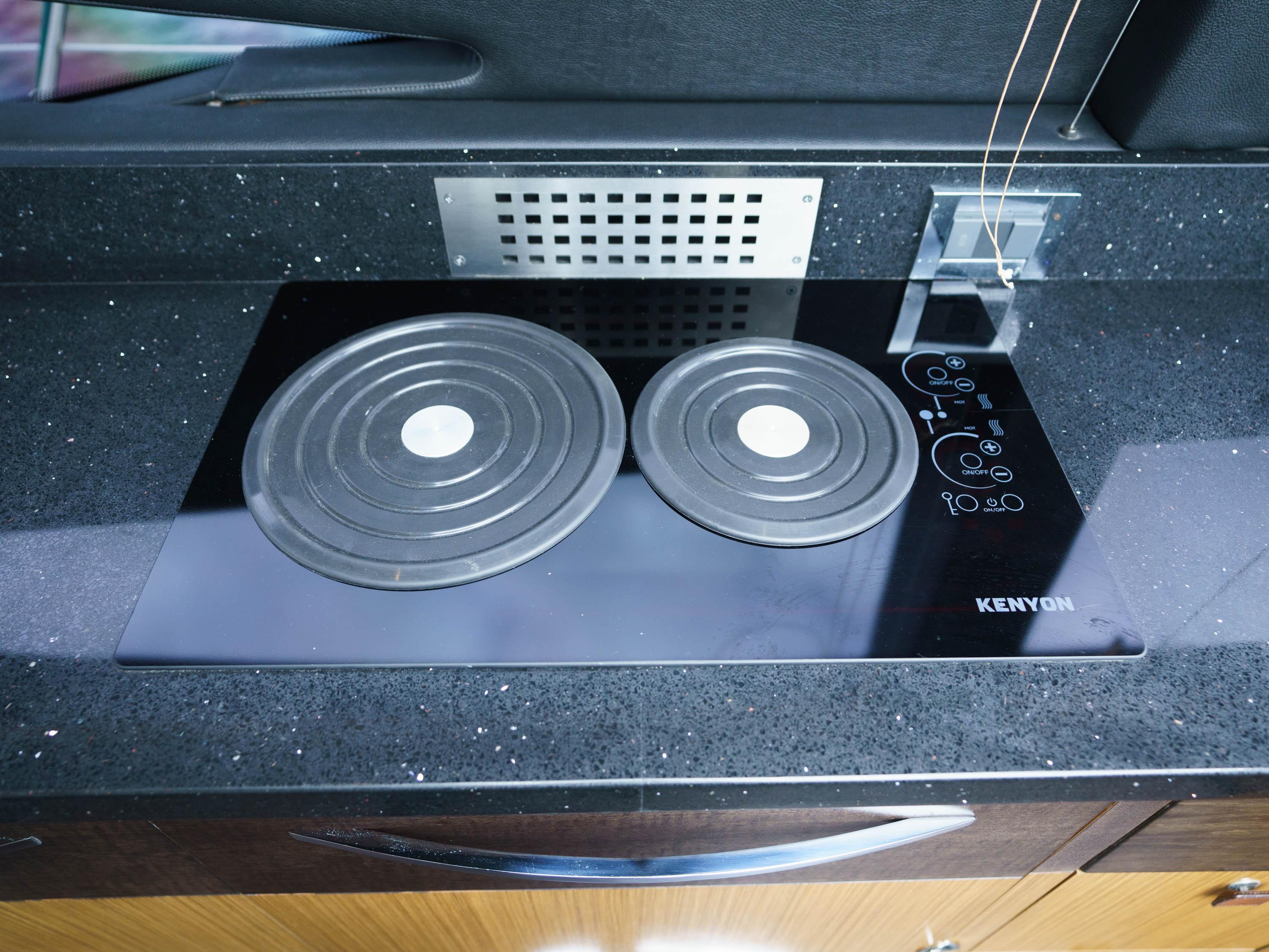 Modern Kenyon stovetop on 2016 Sea Ray L590 yacht kitchen counter.