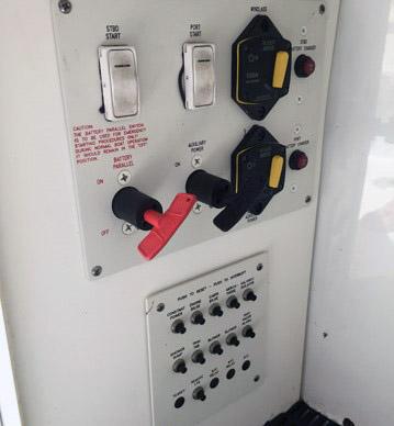Control panel of a 2008 Formula 310 Sun Sport boat with switches and dials.